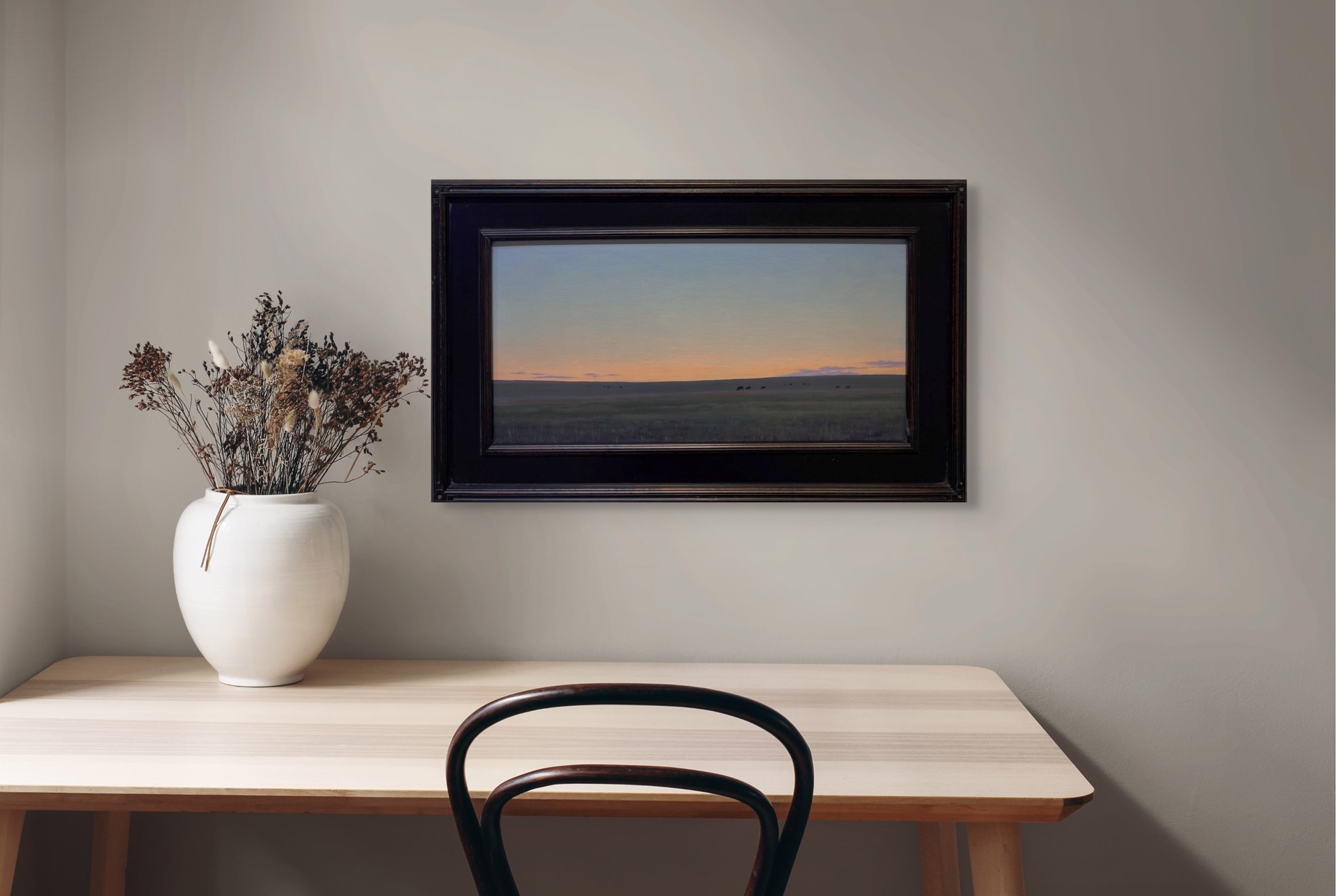 A painting of a herd of cattle grazing in a field at sunset.