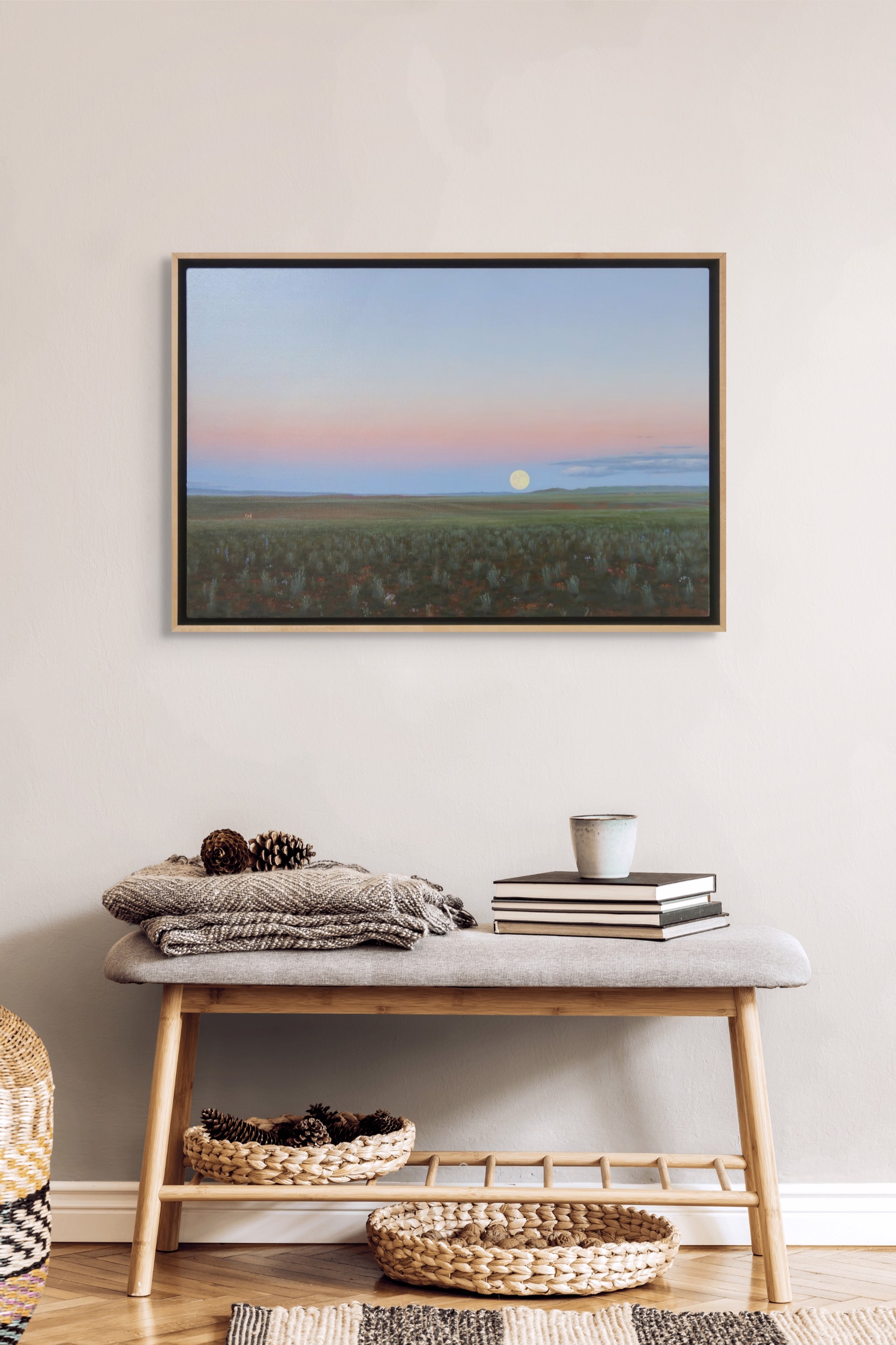 A painting of a field with a full moon in the sky.