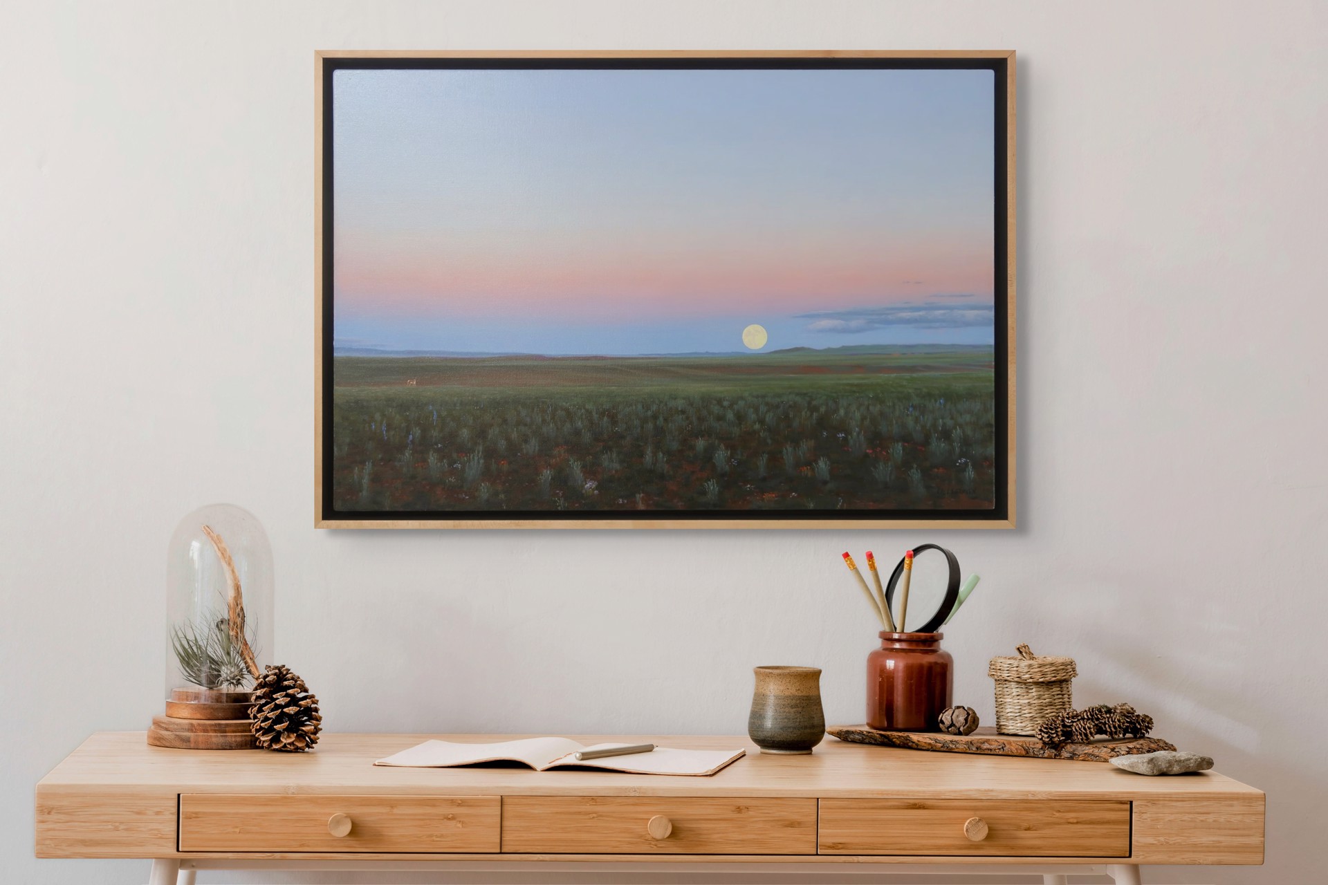 A painting of a field with a full moon in the sky.