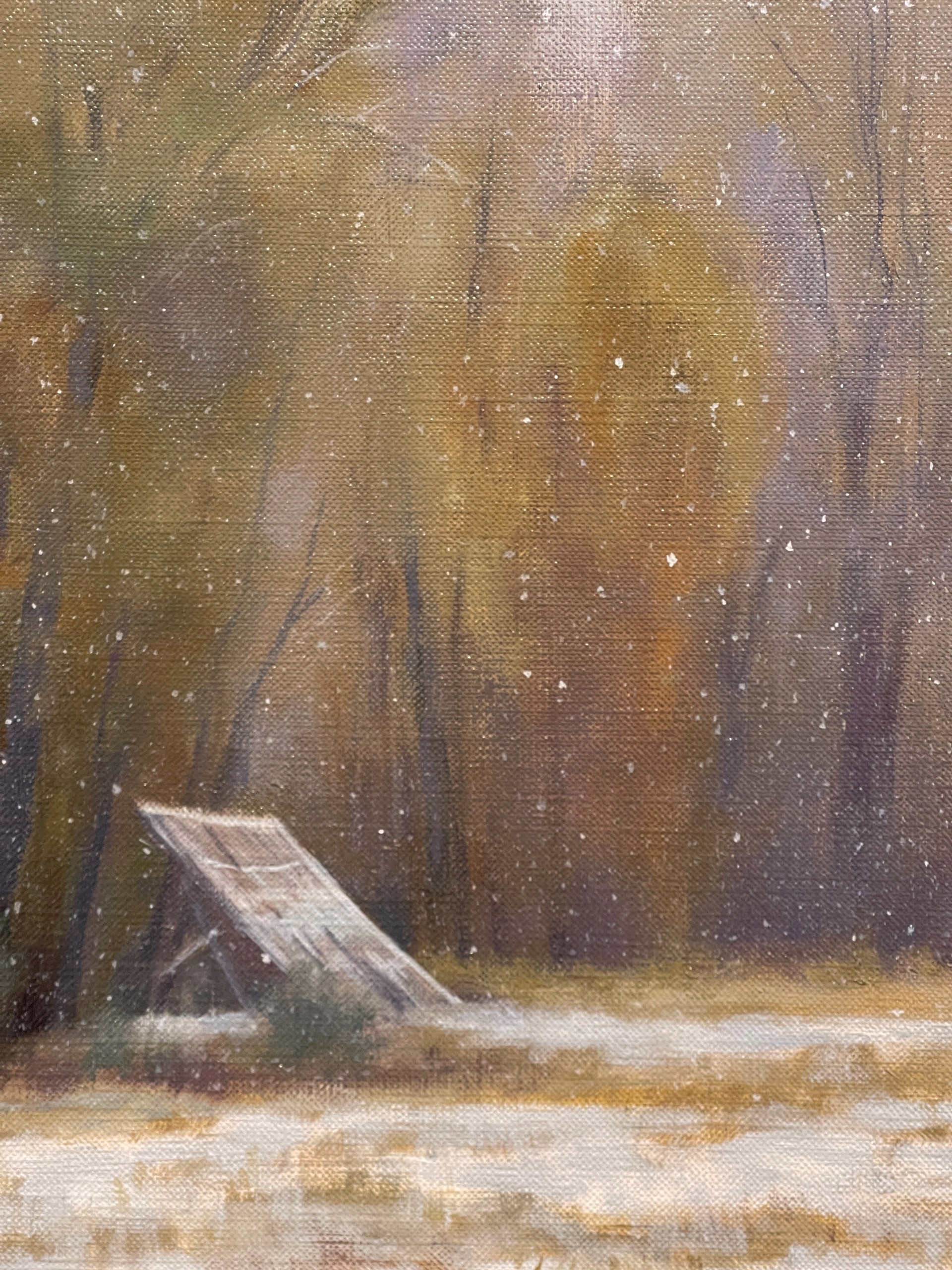 A quiet winter landscape with snow-covered ground, a line of trees, and a slanted board leaning against them.