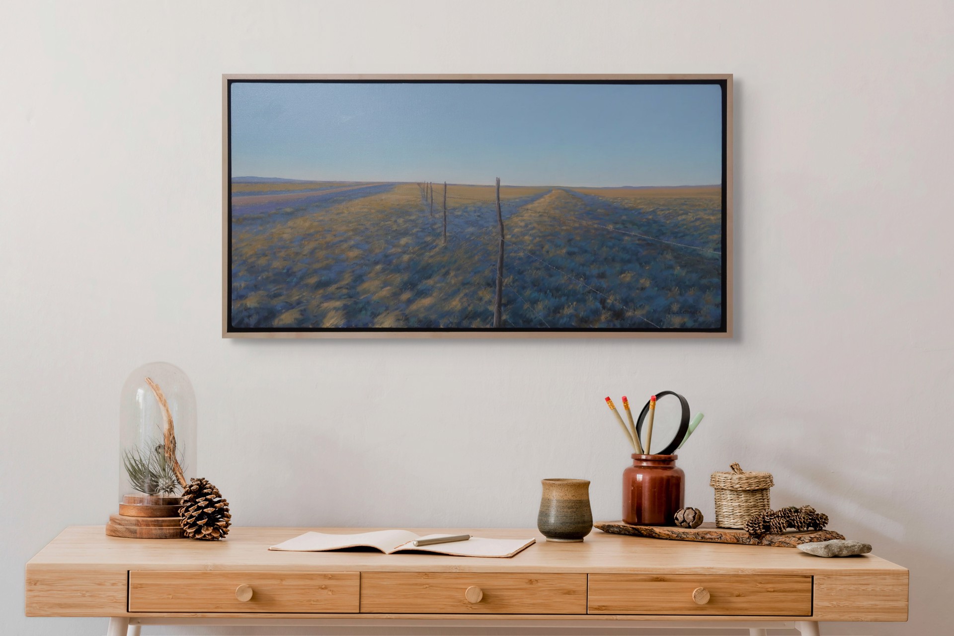 A painting of a field with a fence in the middle.