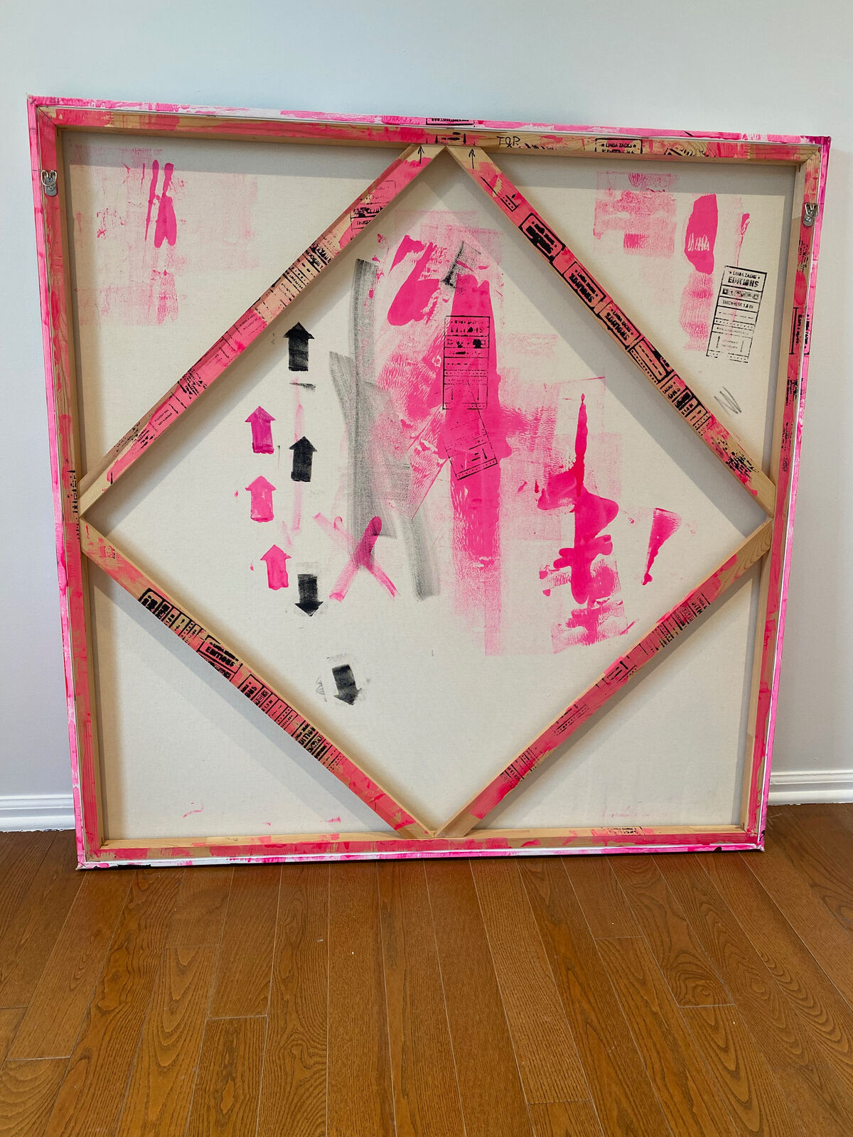 A painting of a cityscape with pink and black paint on it.