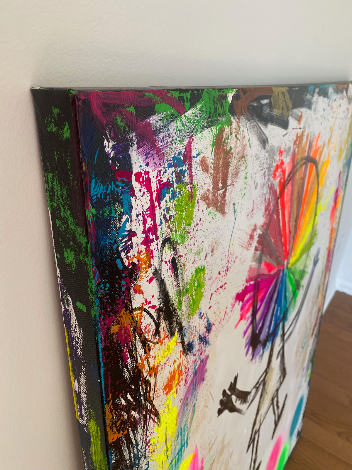 A painting of a person with a colorful wheel on their head.