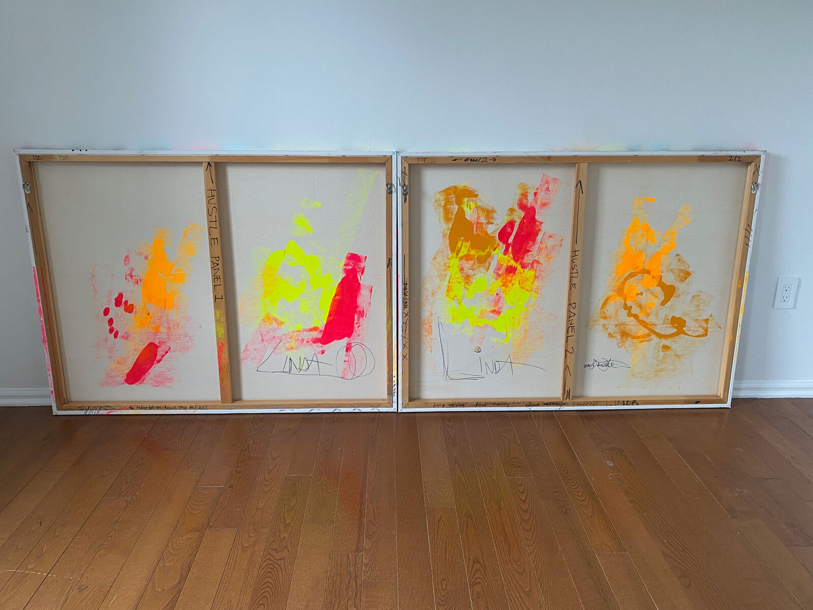 A collage of the word hustle on a wall covered in graffiti.