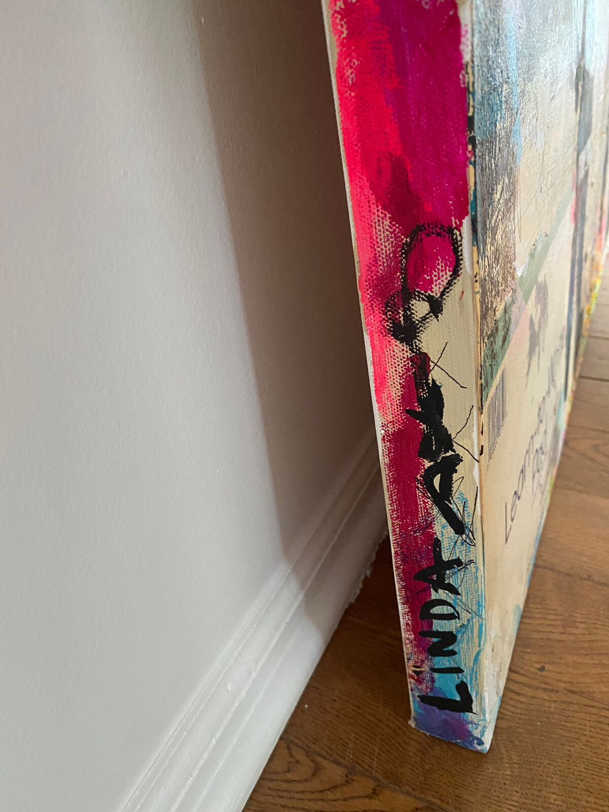 A collage of the word hustle on a wall covered in graffiti.