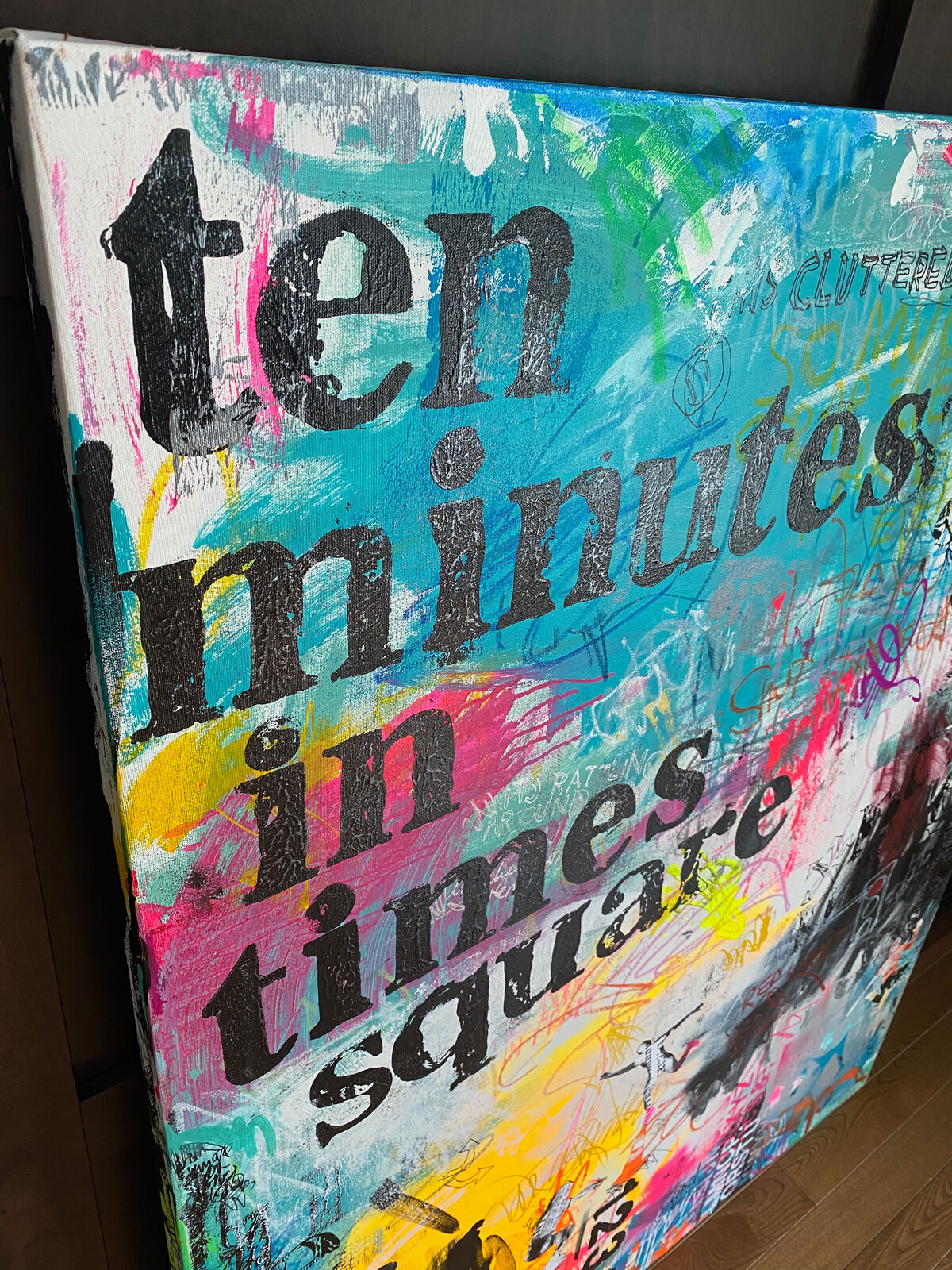 A painting of a wall covered in graffiti with the words ten minutes in times square.