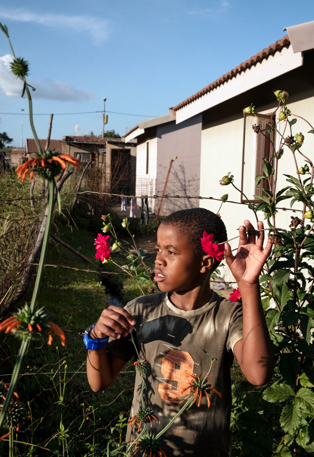 Yonelisa Samela in his grandmother’s garden during South Africa’s first lockdown by Lindokuhle Sobekwa, 2020