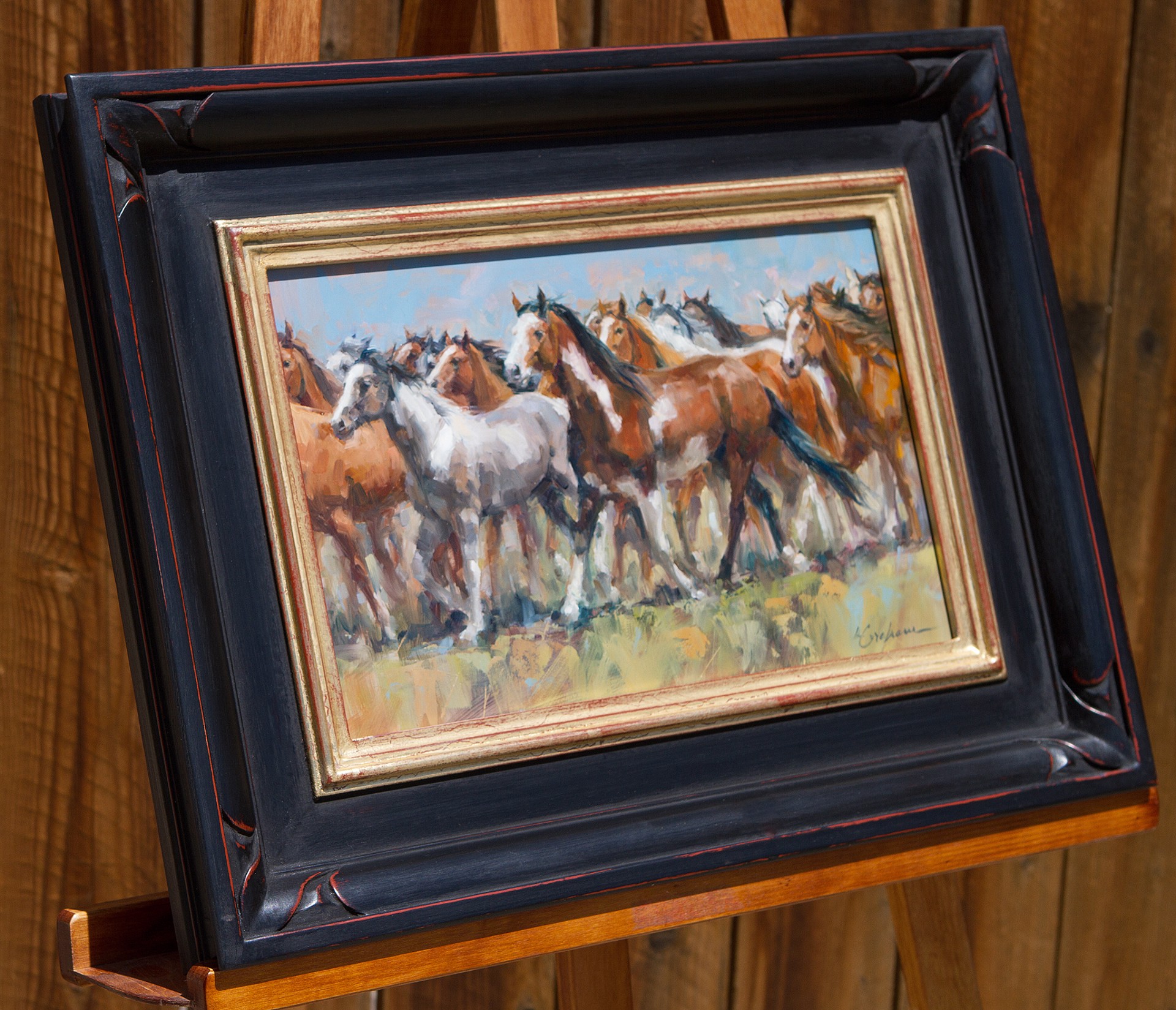 A dynamic painting of a herd of horses in motion.