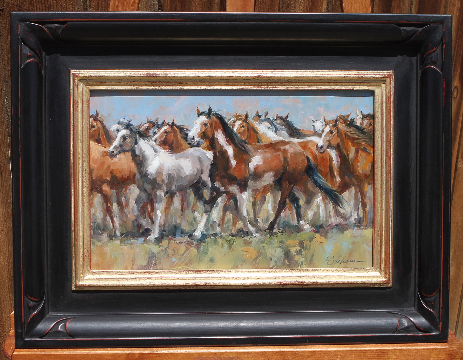 A dynamic painting of a herd of horses in motion.