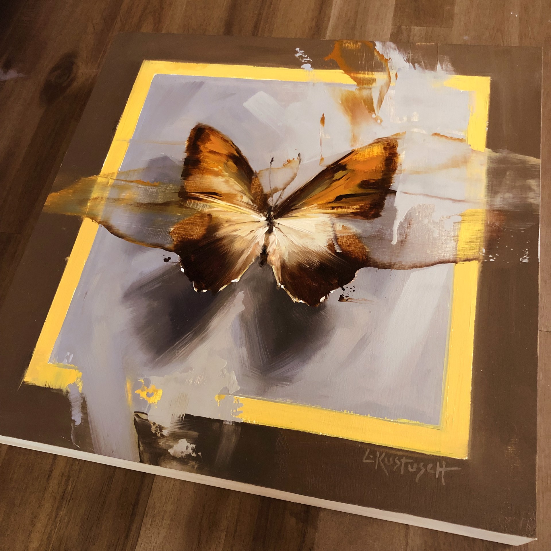 A painting of a butterfly on a brown background.
