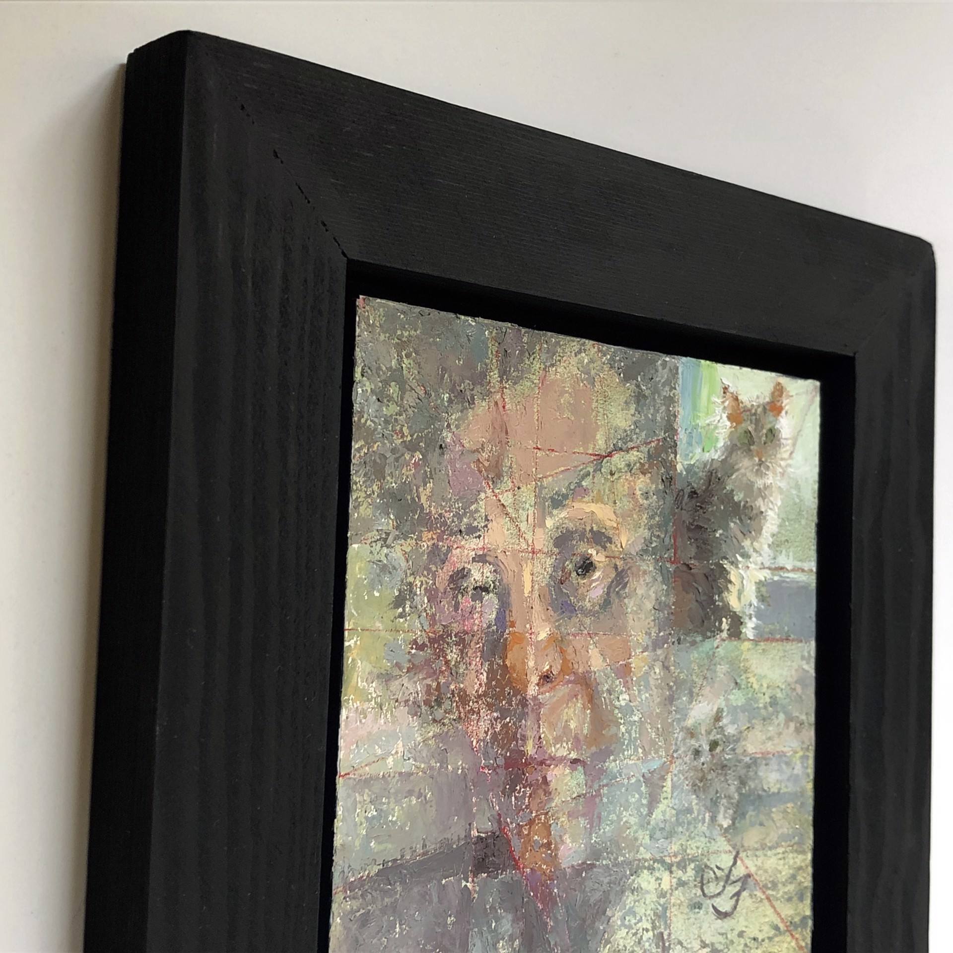 A painting of a man with a cat on his shoulder.