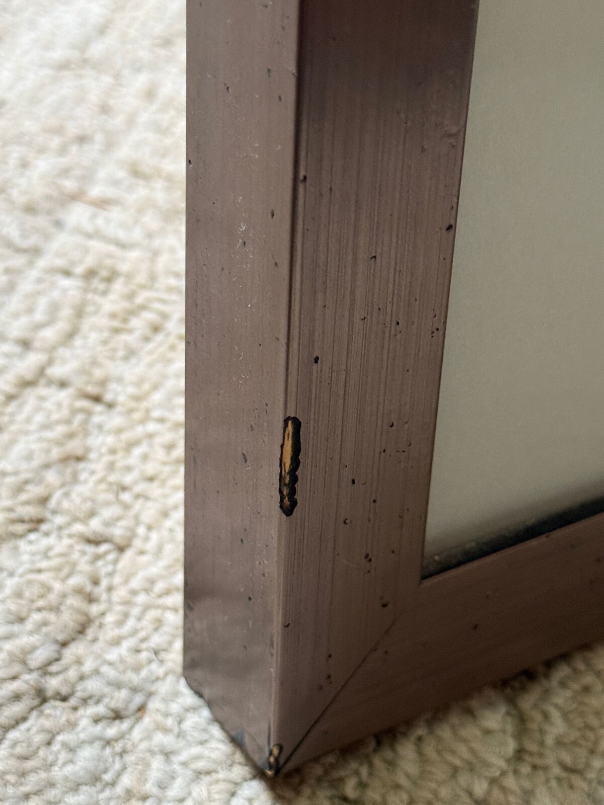 A painting of a man standing in front of a wall covered in graffiti.