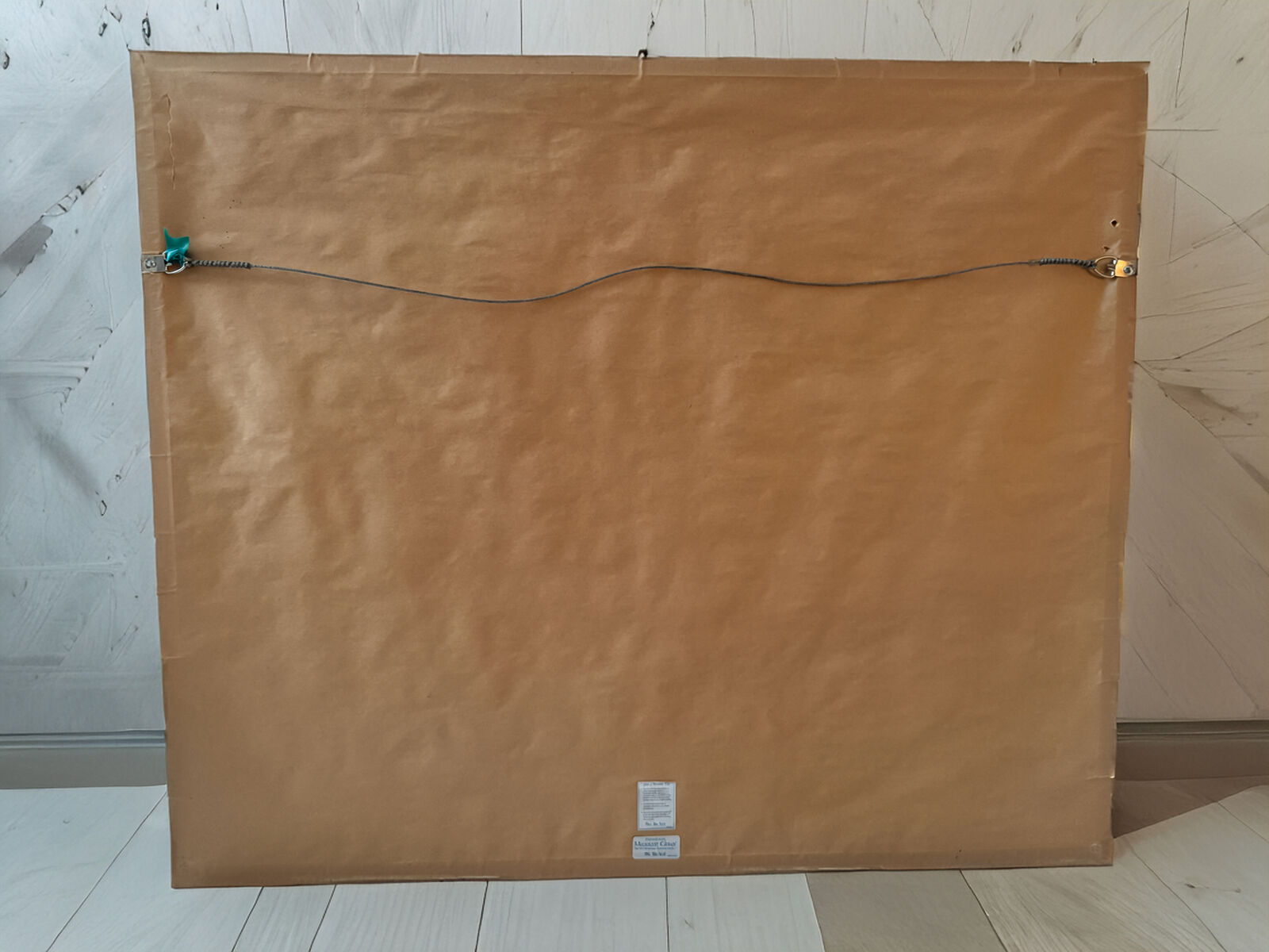 A painting of a man standing in front of a wall covered in graffiti.