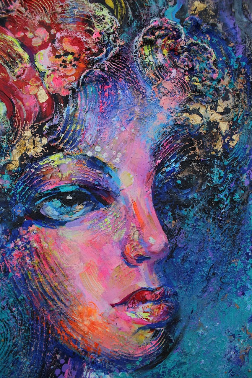 A painting of a woman's face with colorful hair.