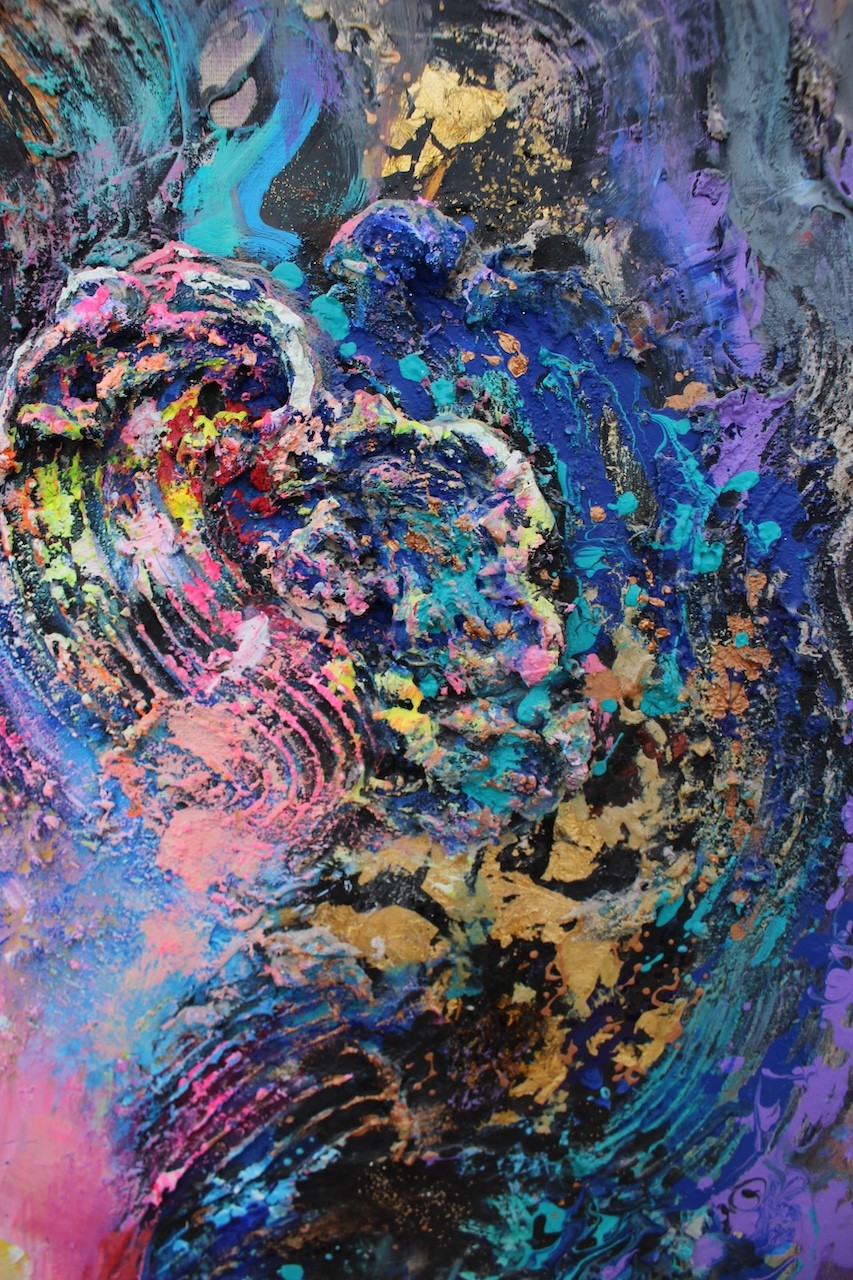 A painting of a woman's face with colorful hair.