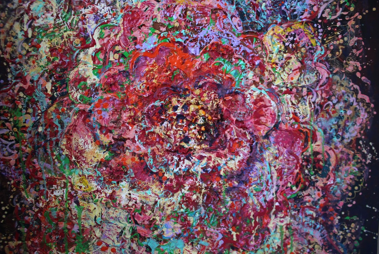 A vibrant abstract floral explosion bursting with reds, pinks, and greens against a dark void.