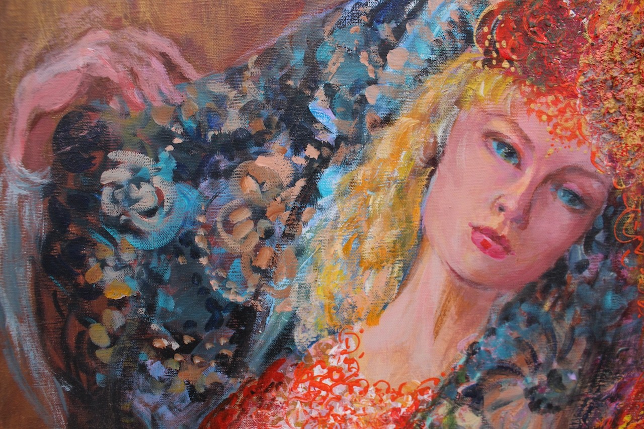 Three figures in flowing, floral-patterned gowns pose closely together against a warm background.