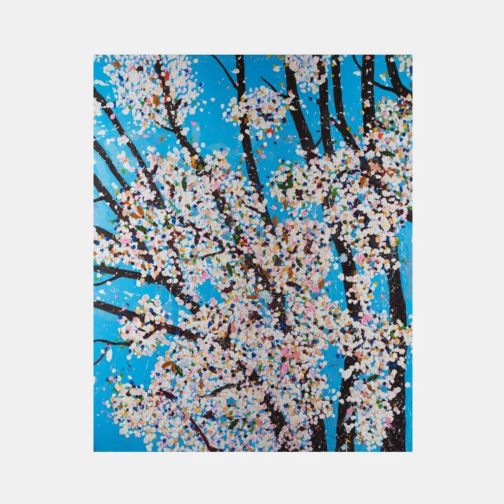 A vibrant painting of blossoming trees against a vivid blue sky.