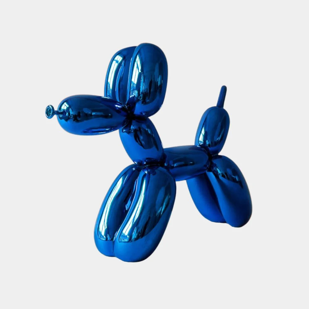 A glossy blue balloon animal sculpture shaped like a dog against a plain background.