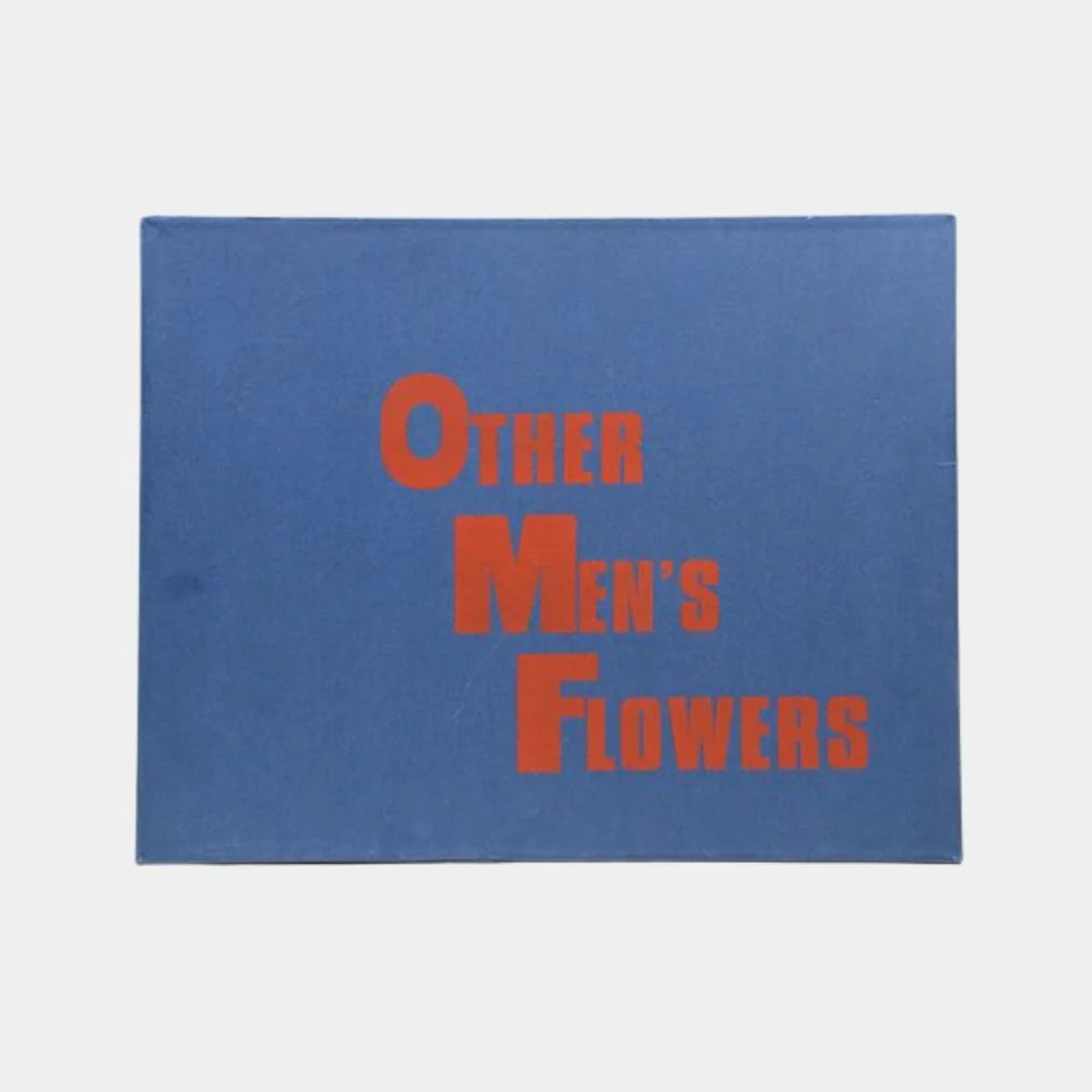 A minimalist print featuring stacked orange text on a blue background.