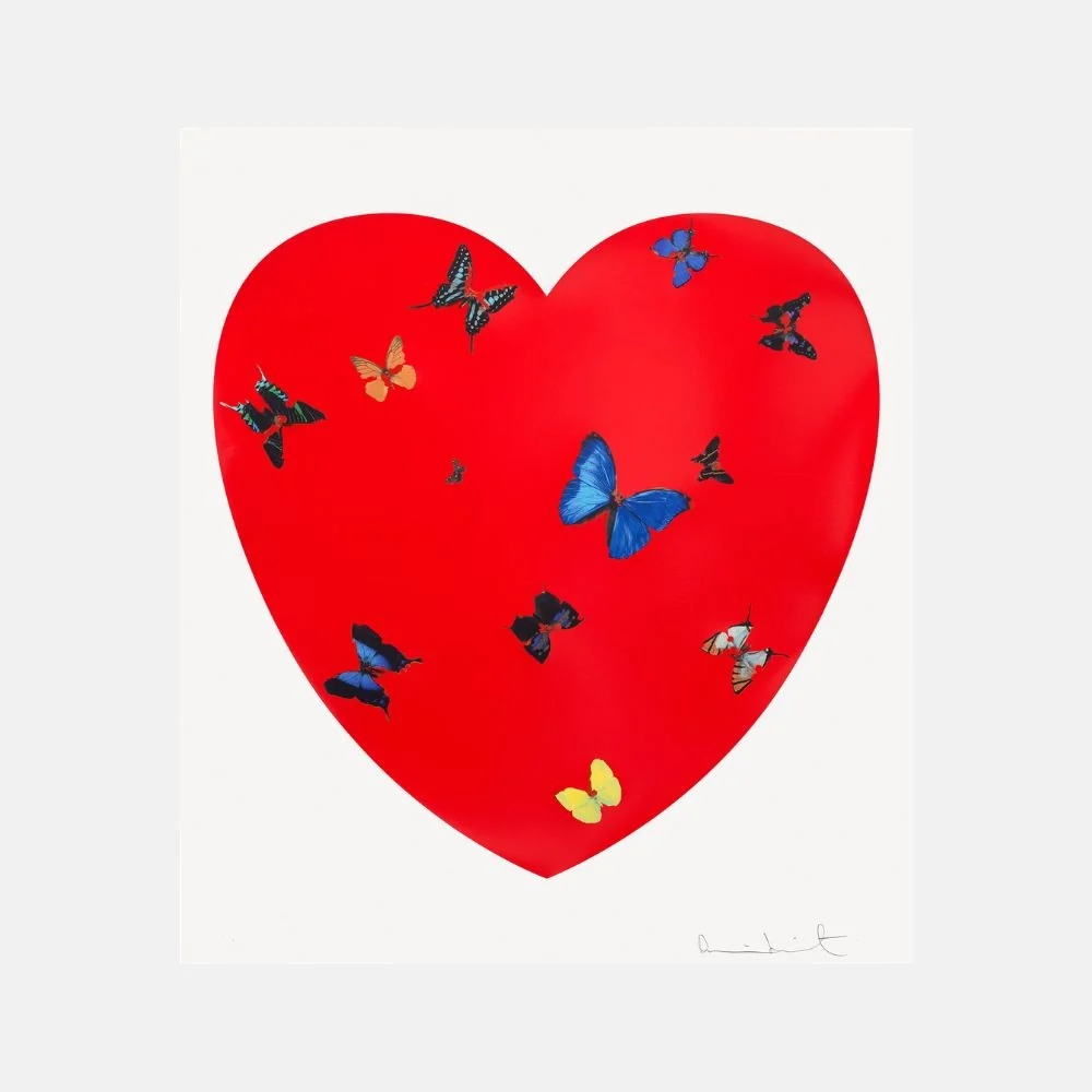 A bold red heart filled with a colorful swarm of butterflies.