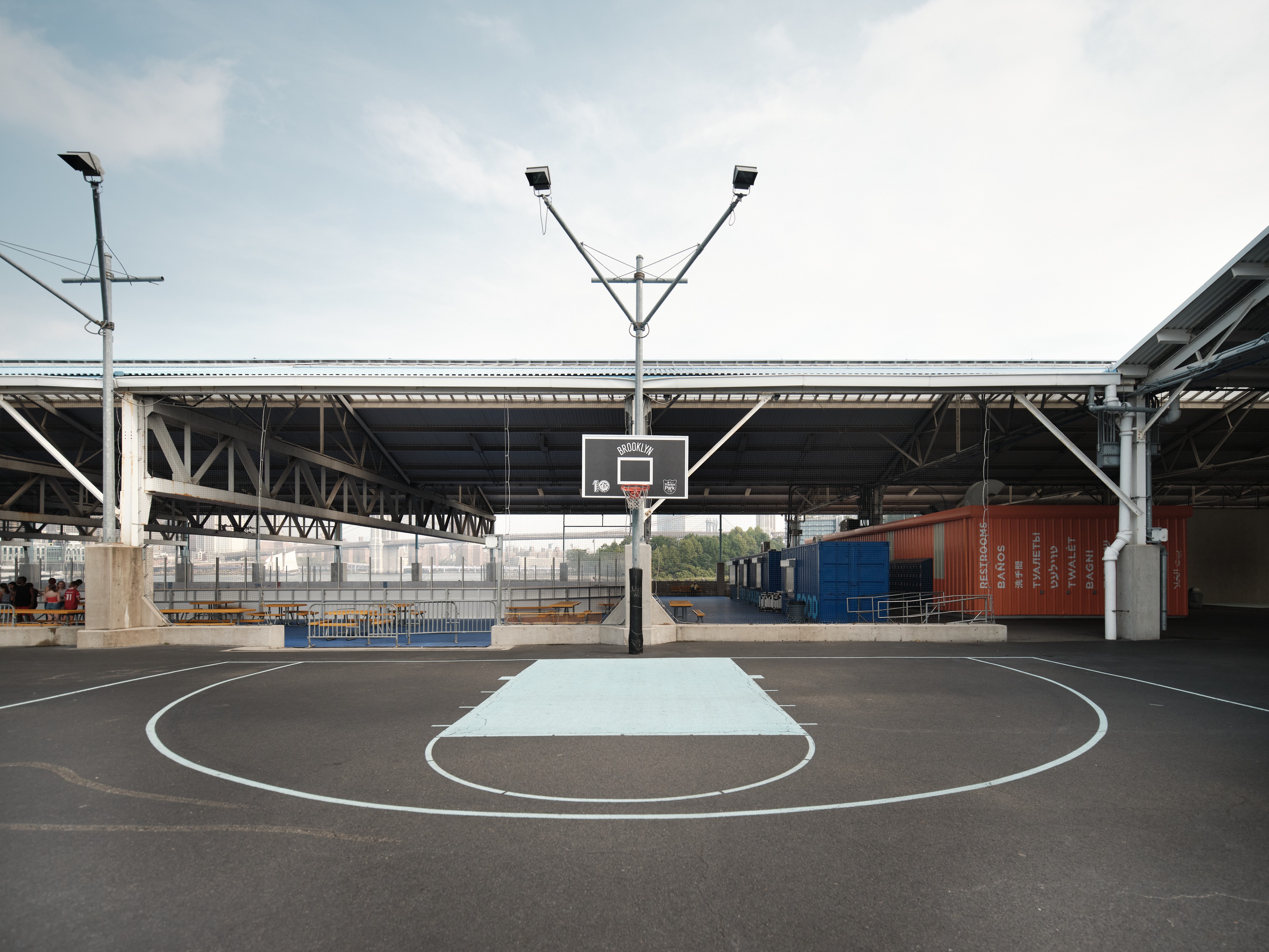 A basketball court with a basketball hoop in the middle of it.