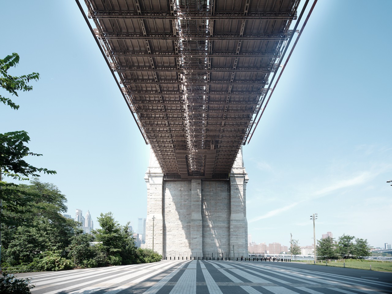 A view of the underside of a bridge over a city street.