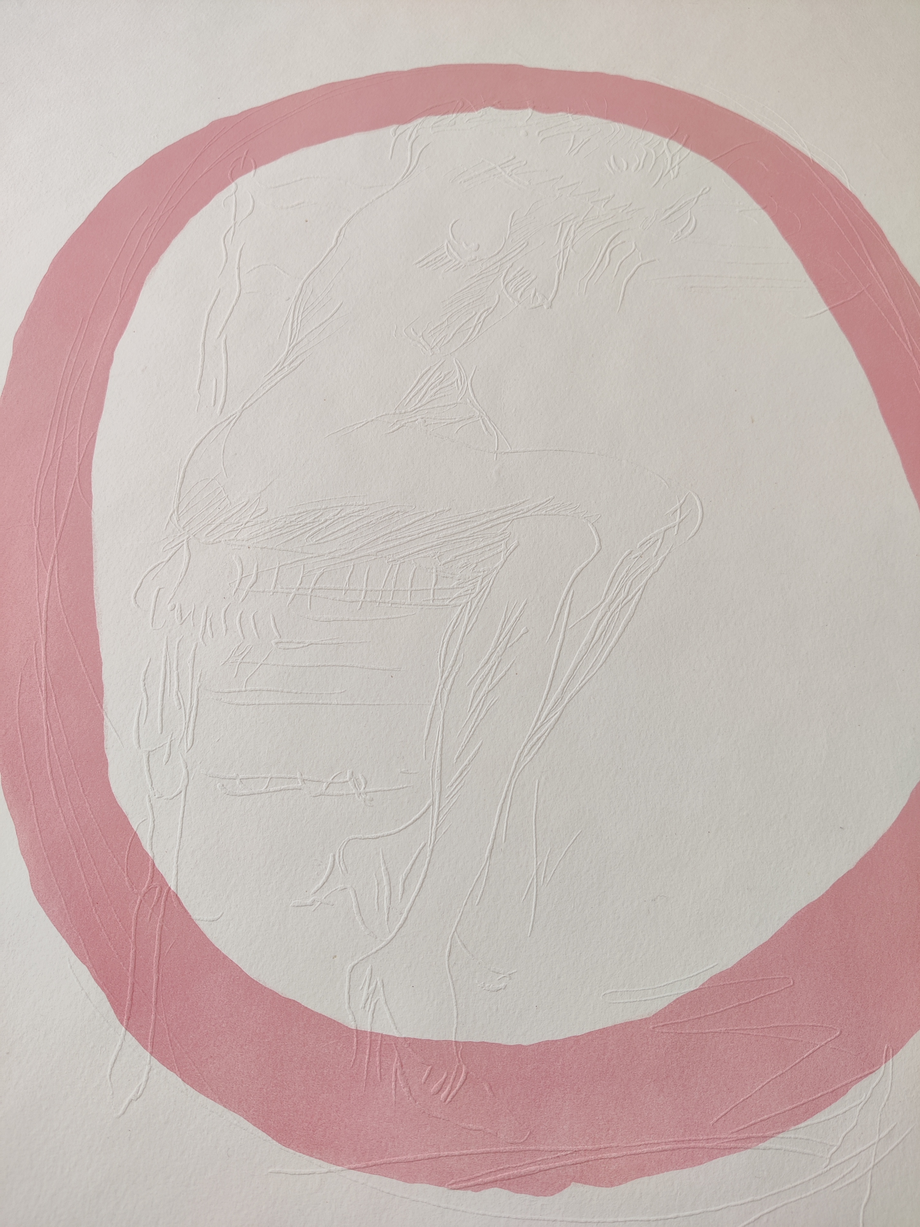 A pink circle with a drawing of a woman in it.