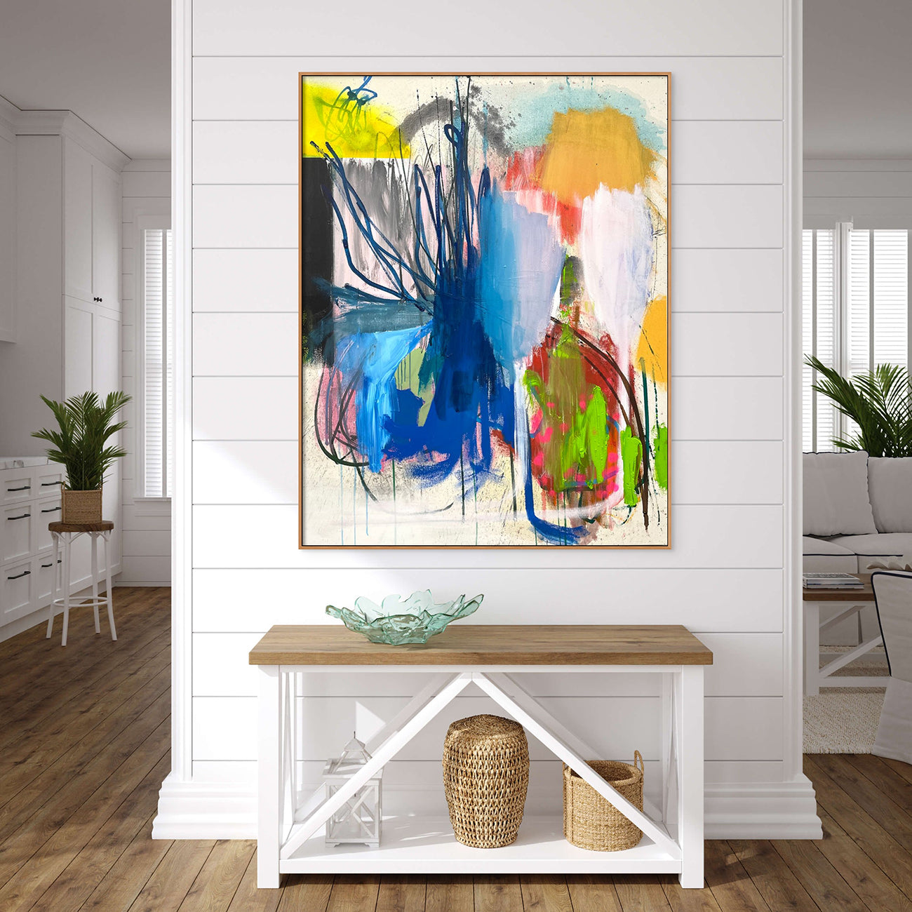 A painting with blue, yellow, red, green, and blue paint on a white background.