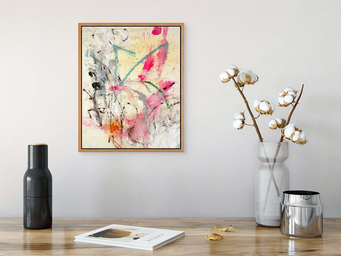 A painting of pink and blue paint splatters on a white background.