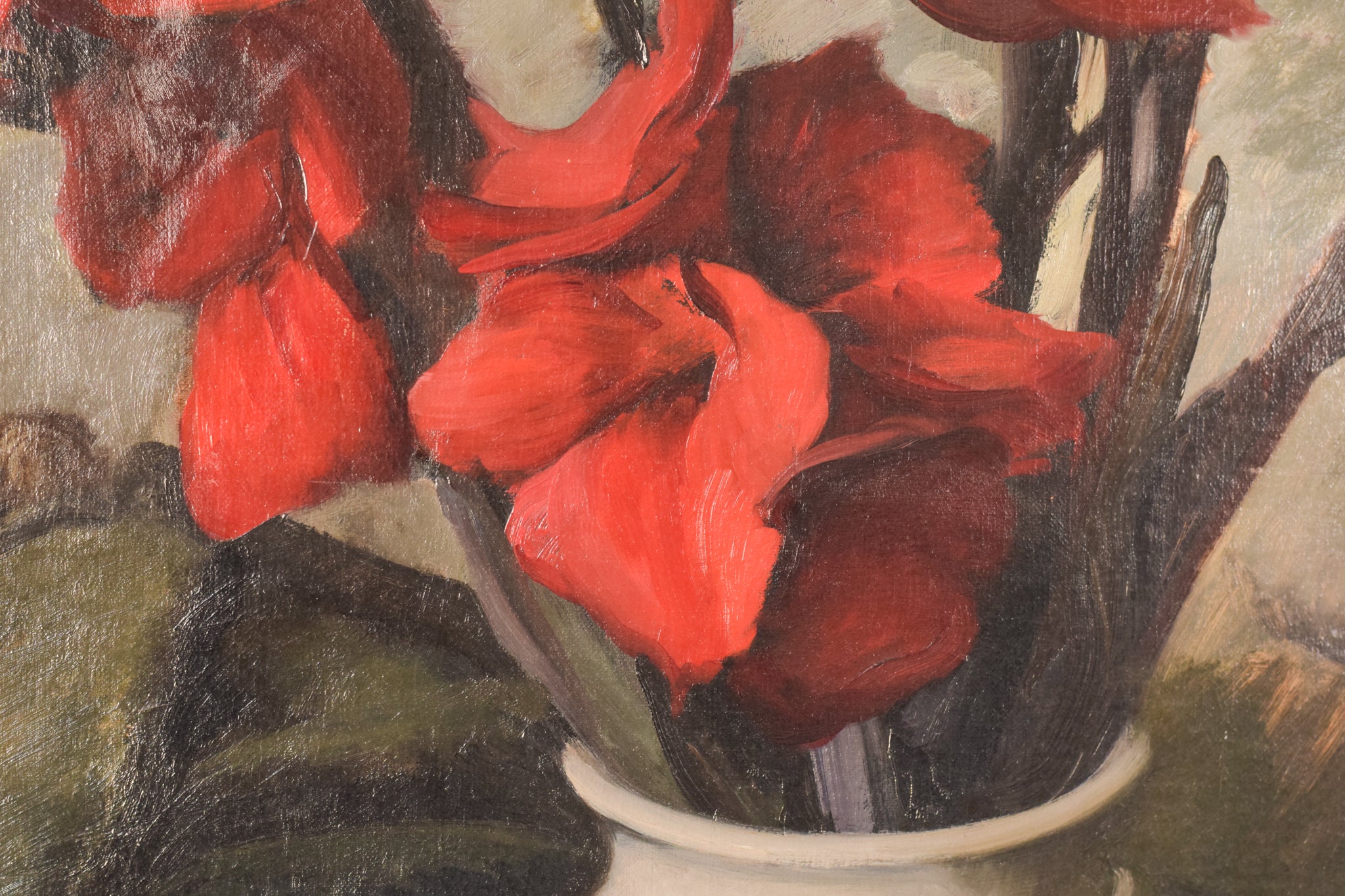 A painting of red flowers in a white vase on a table.