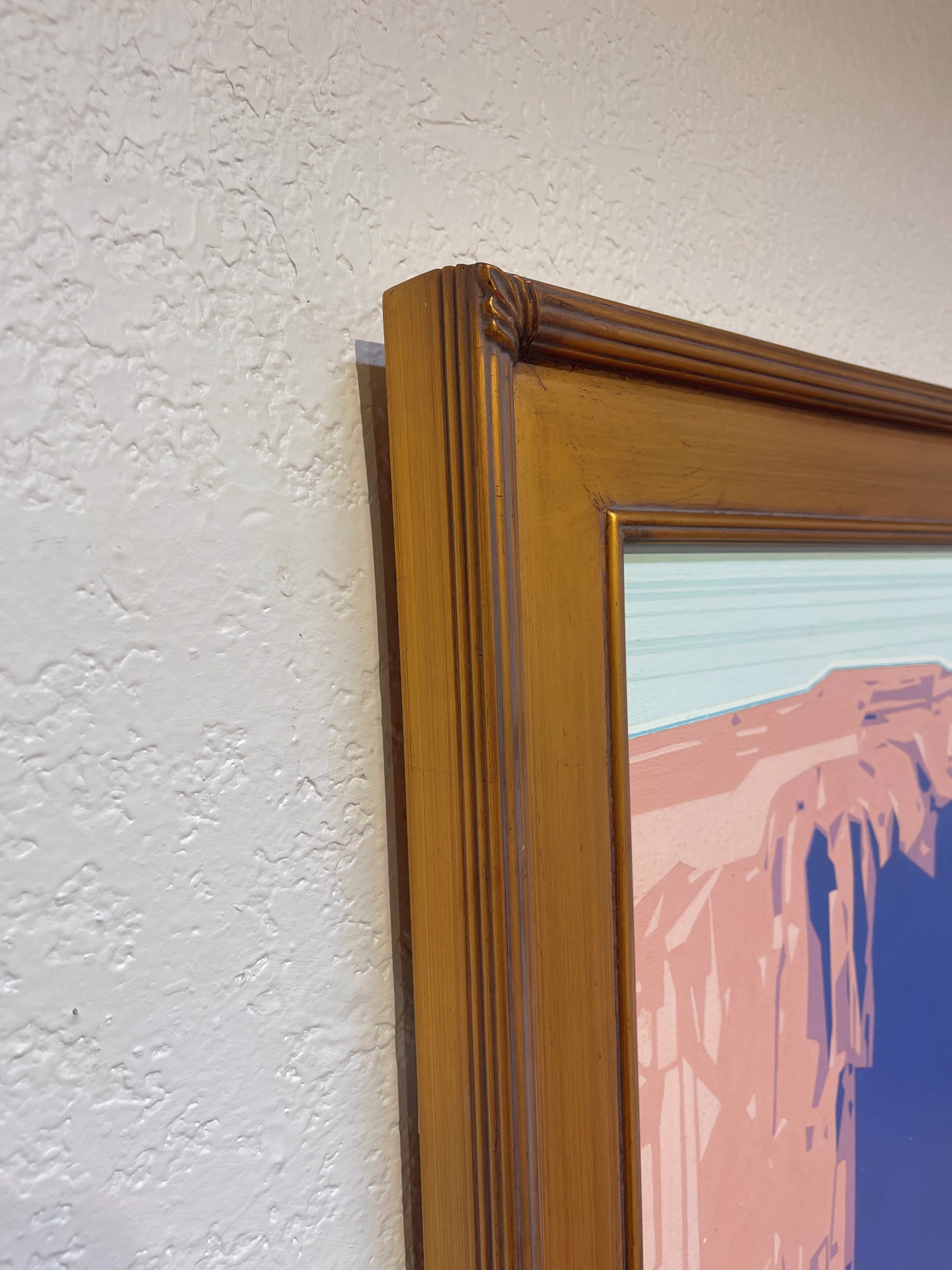 A painting of a desert landscape with a mountain in the background.