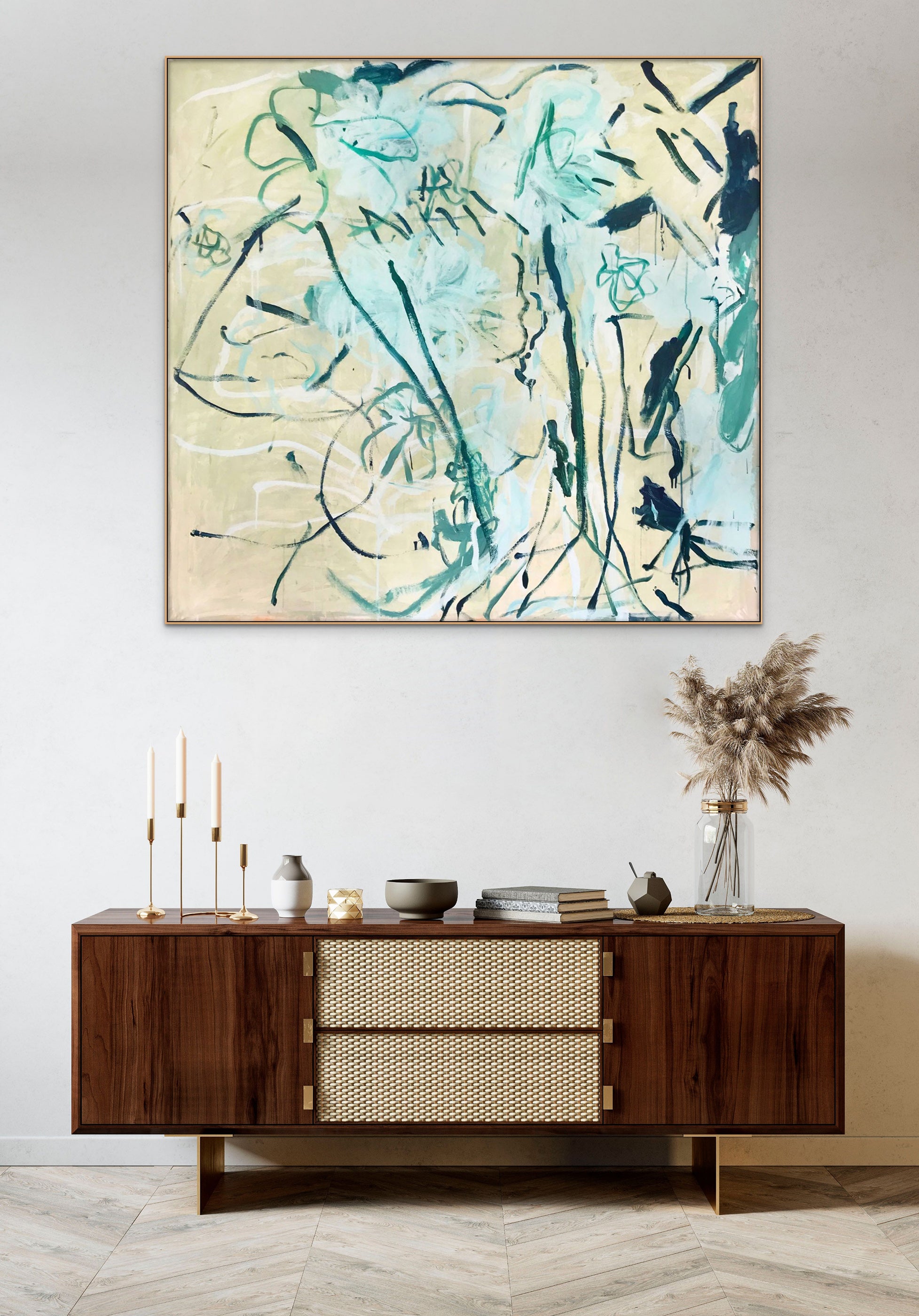 A painting with blue and green paint on a beige background.