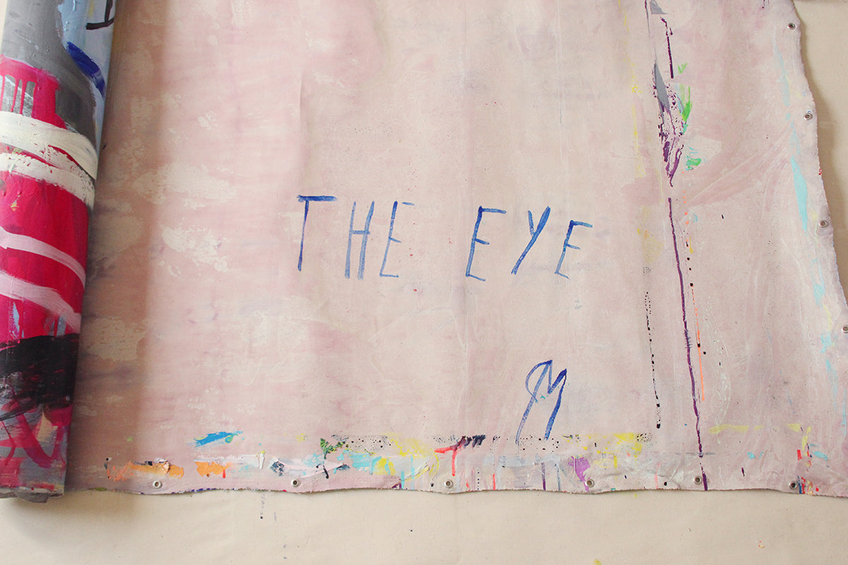 A large abstract painting on a white wall.