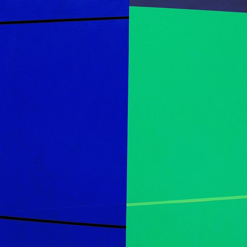A blue and green painting on a white wall.