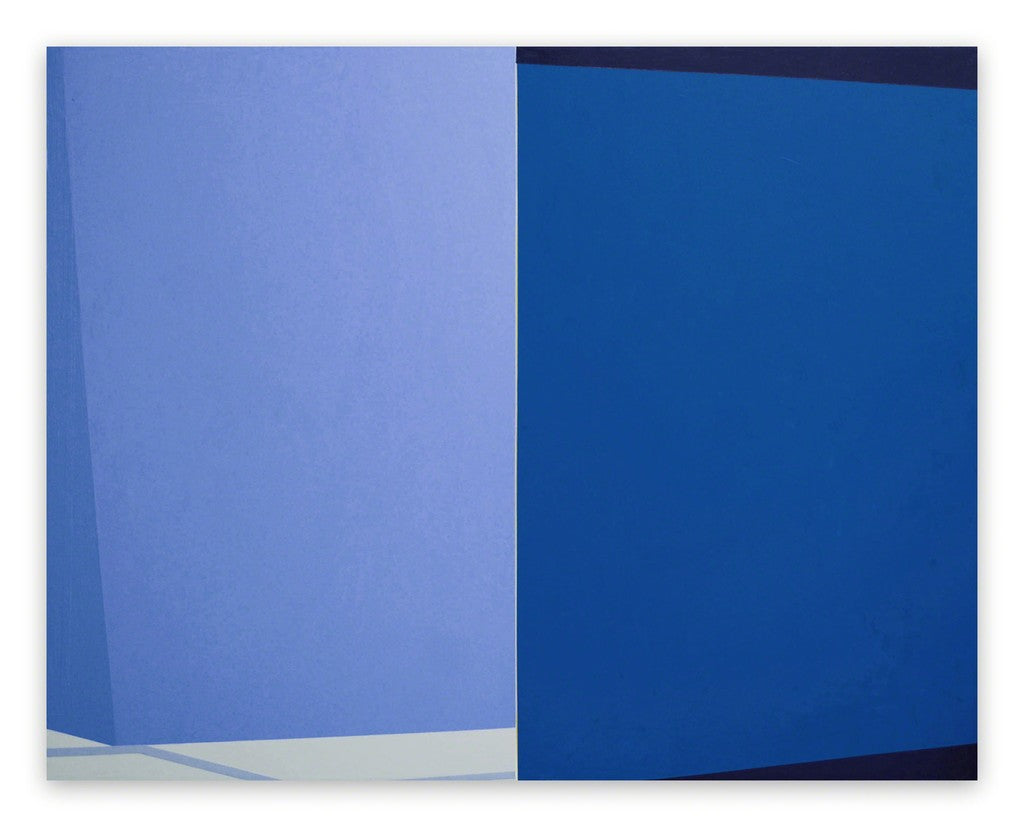 A blue and white painting on a white wall.