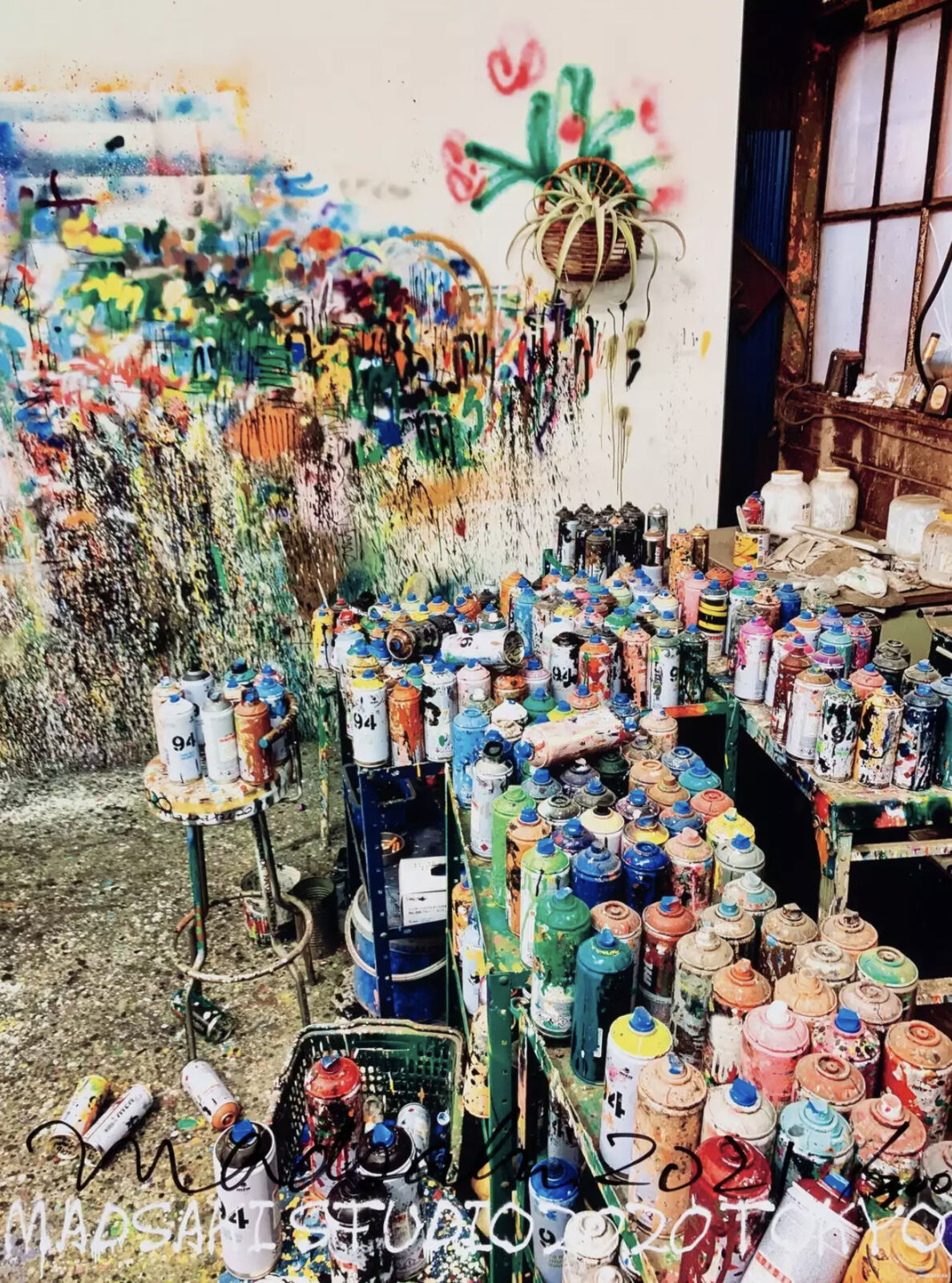 A room filled with lots of spray paint cans.