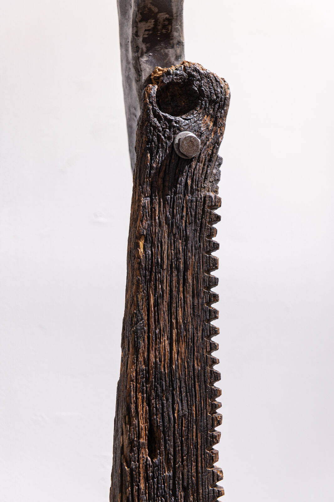 Artwork by Maggie Otieno, Fafanua Tena (Explain It Again), Made of Mild steel with railway sleepers 