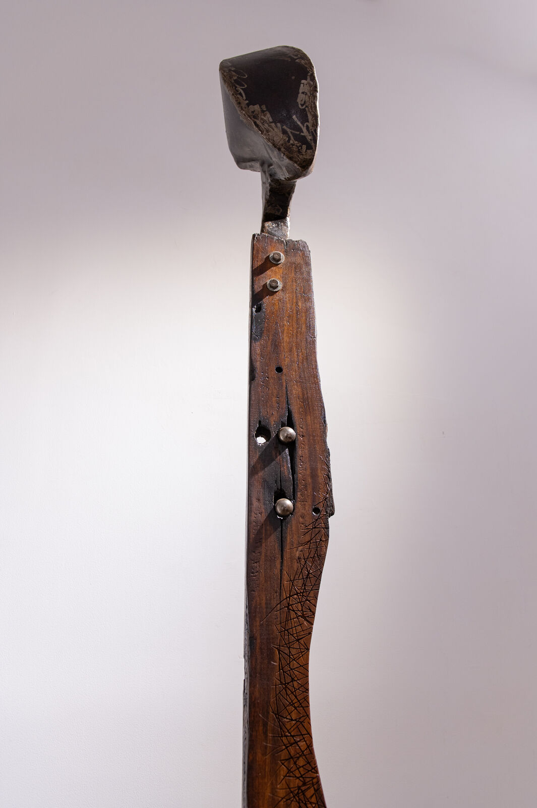 Artwork by Maggie Otieno, Sojourner 2, Made of Railway Sleepers with mixed medium materials 