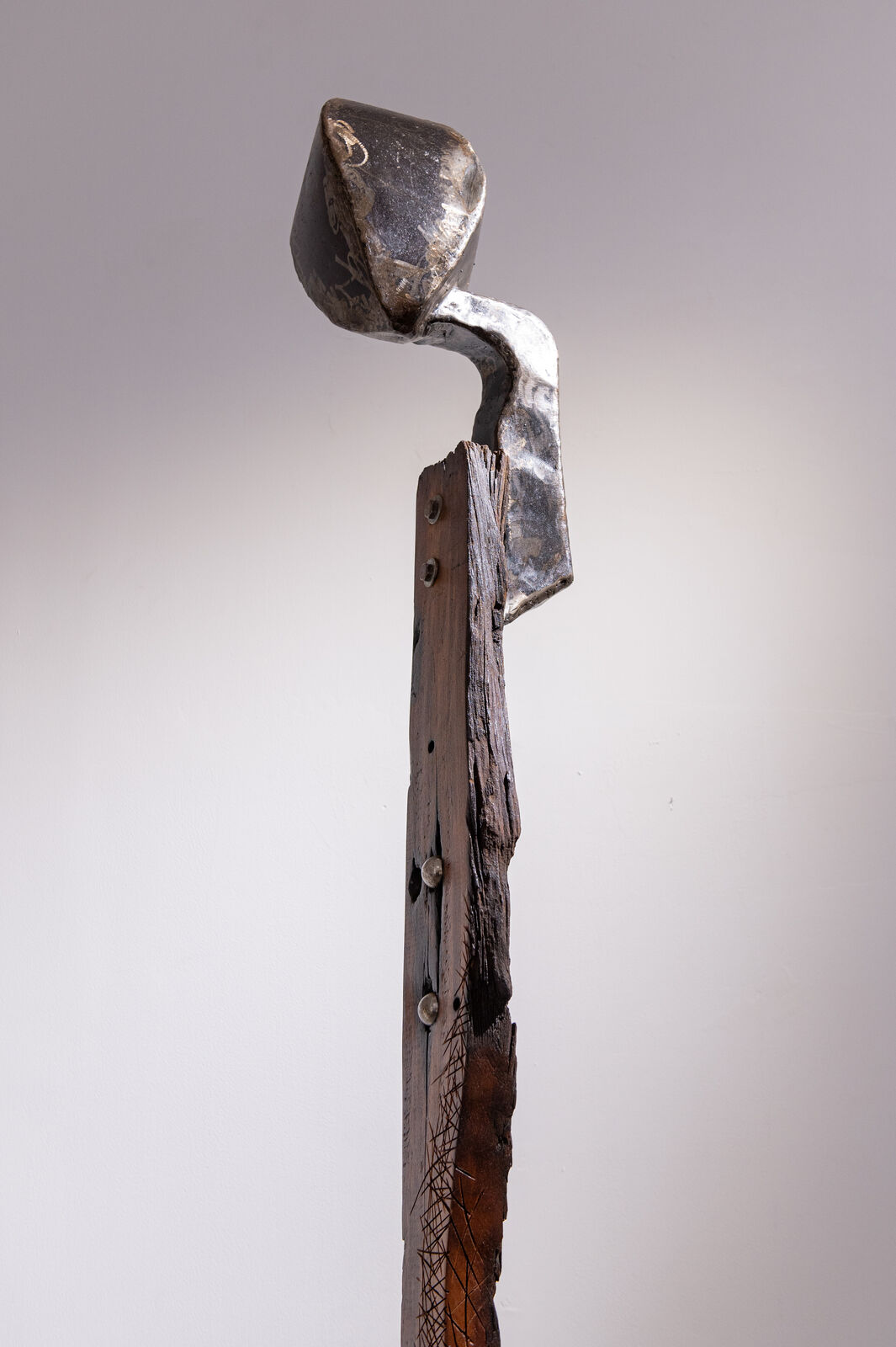 Artwork by Maggie Otieno, Sojourner 2, Made of Railway Sleepers with mixed medium materials 