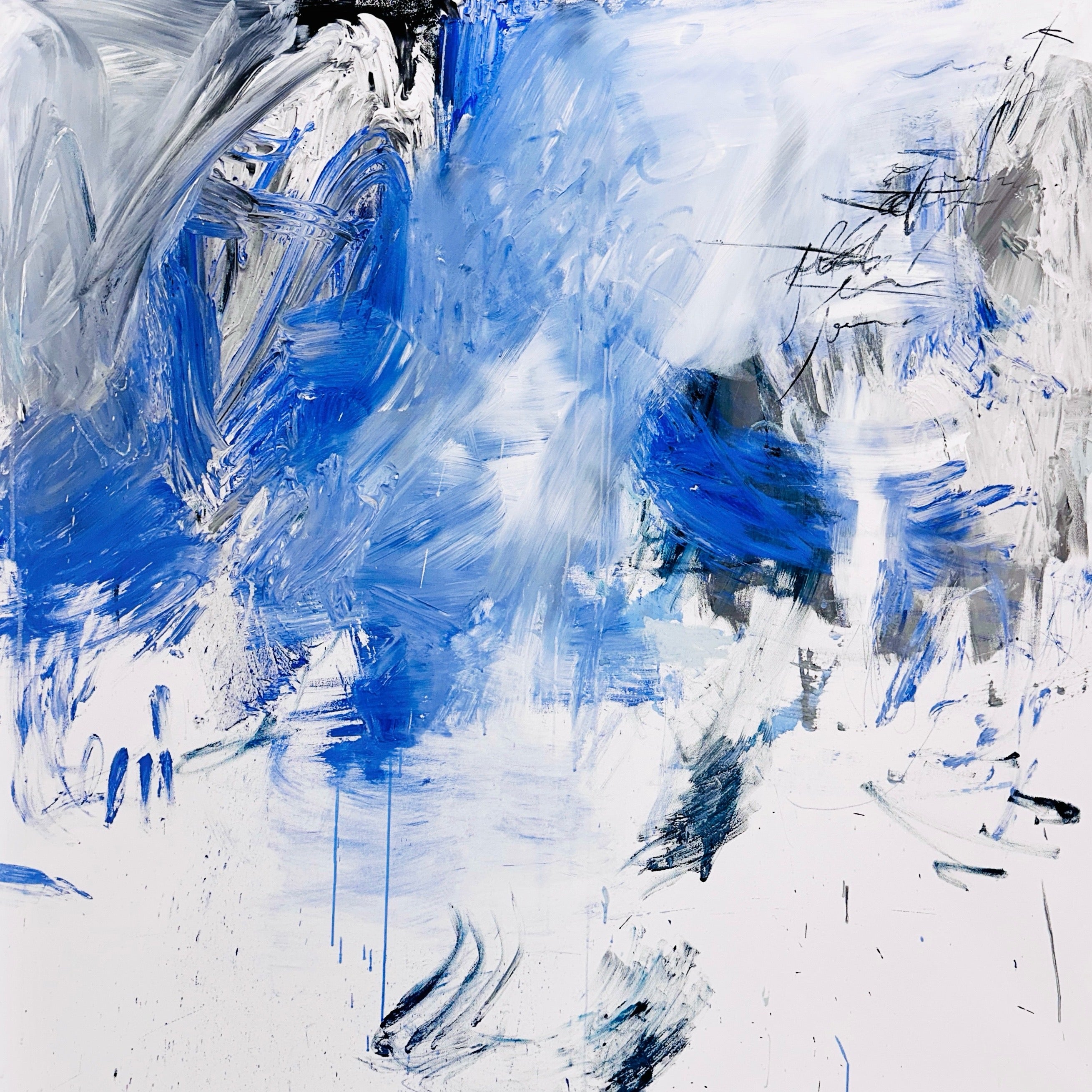 A blue and white abstract painting on a white wall.