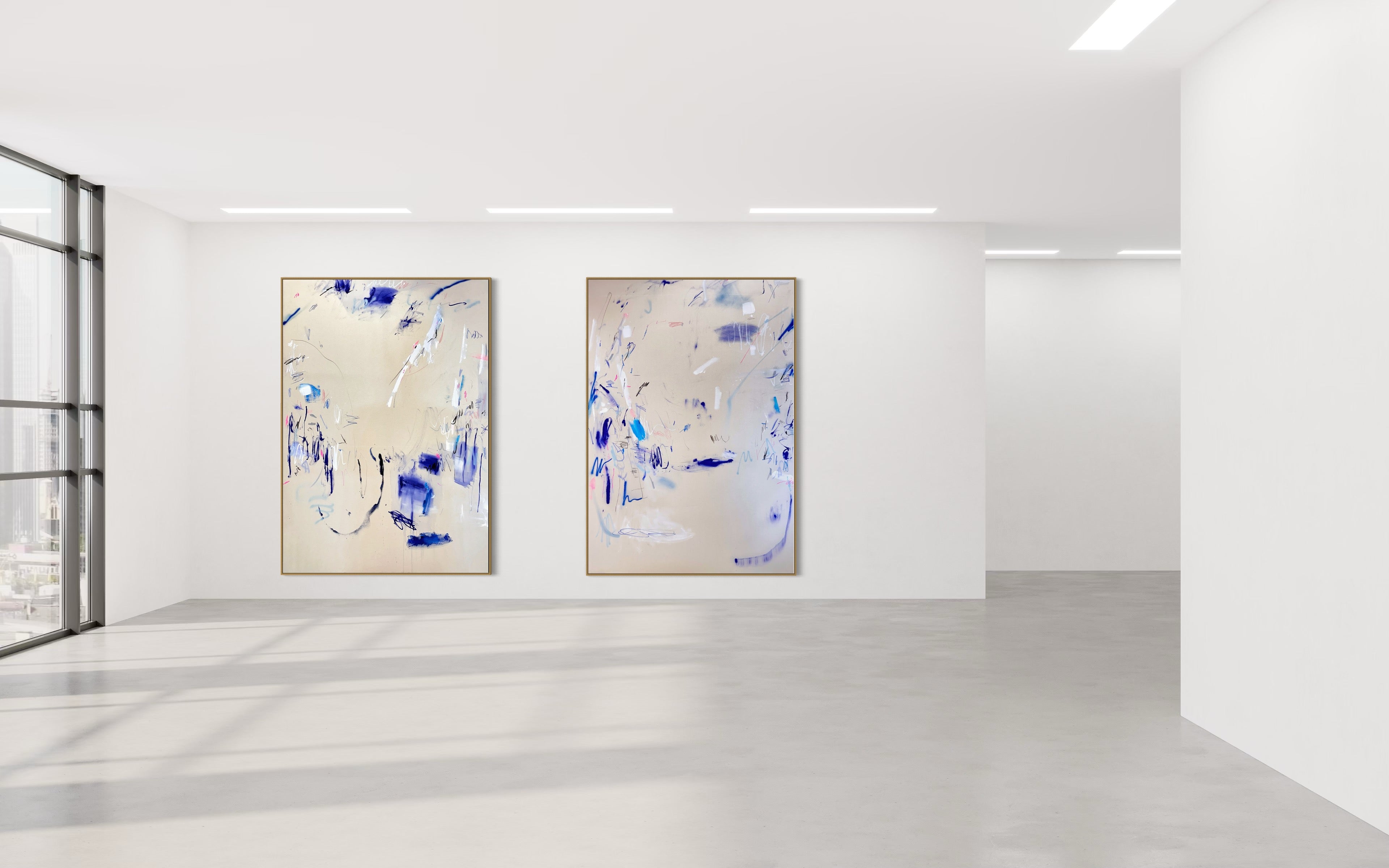 A pair of paintings with blue and white paint on them.