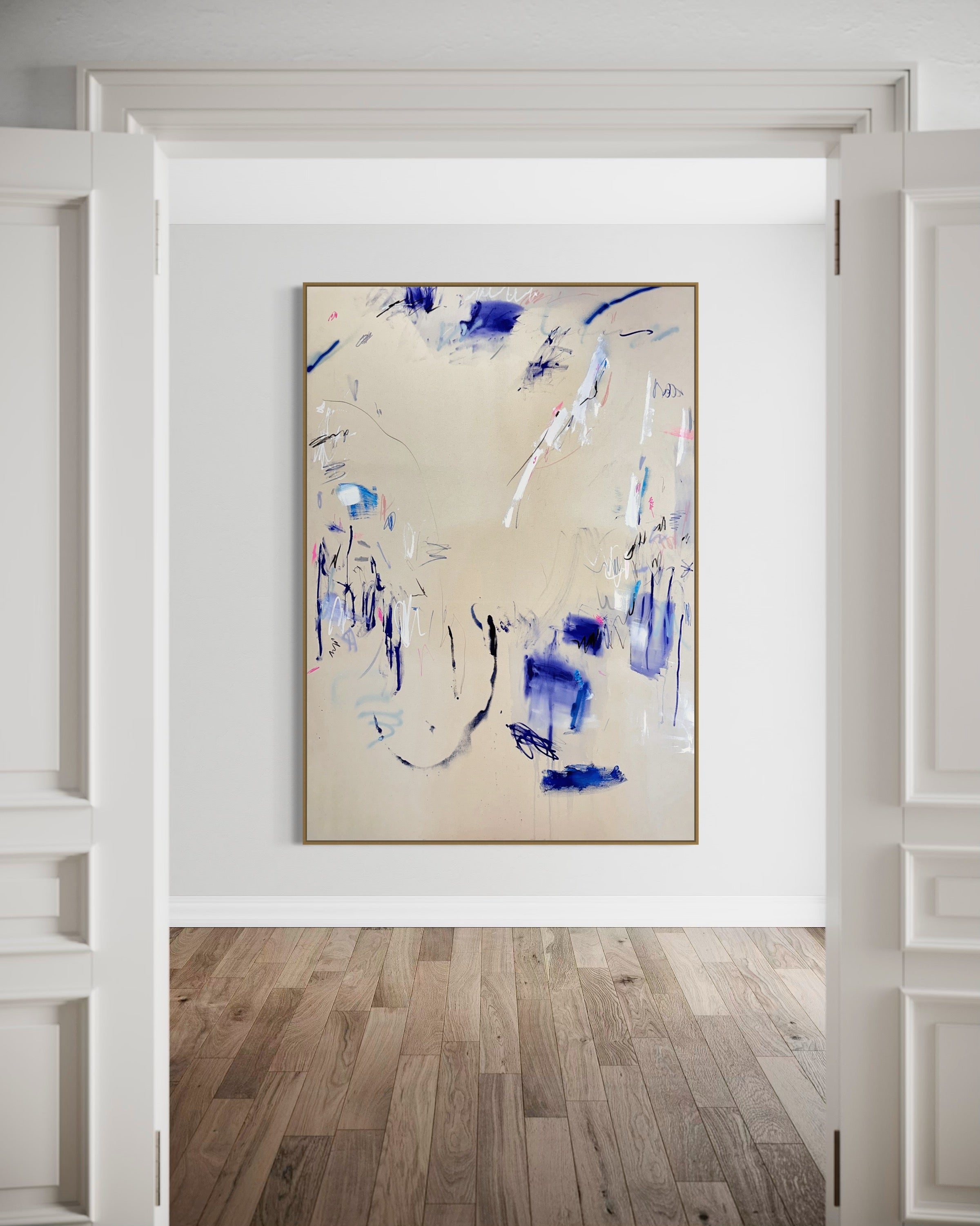 A pair of paintings with blue and white paint on them.