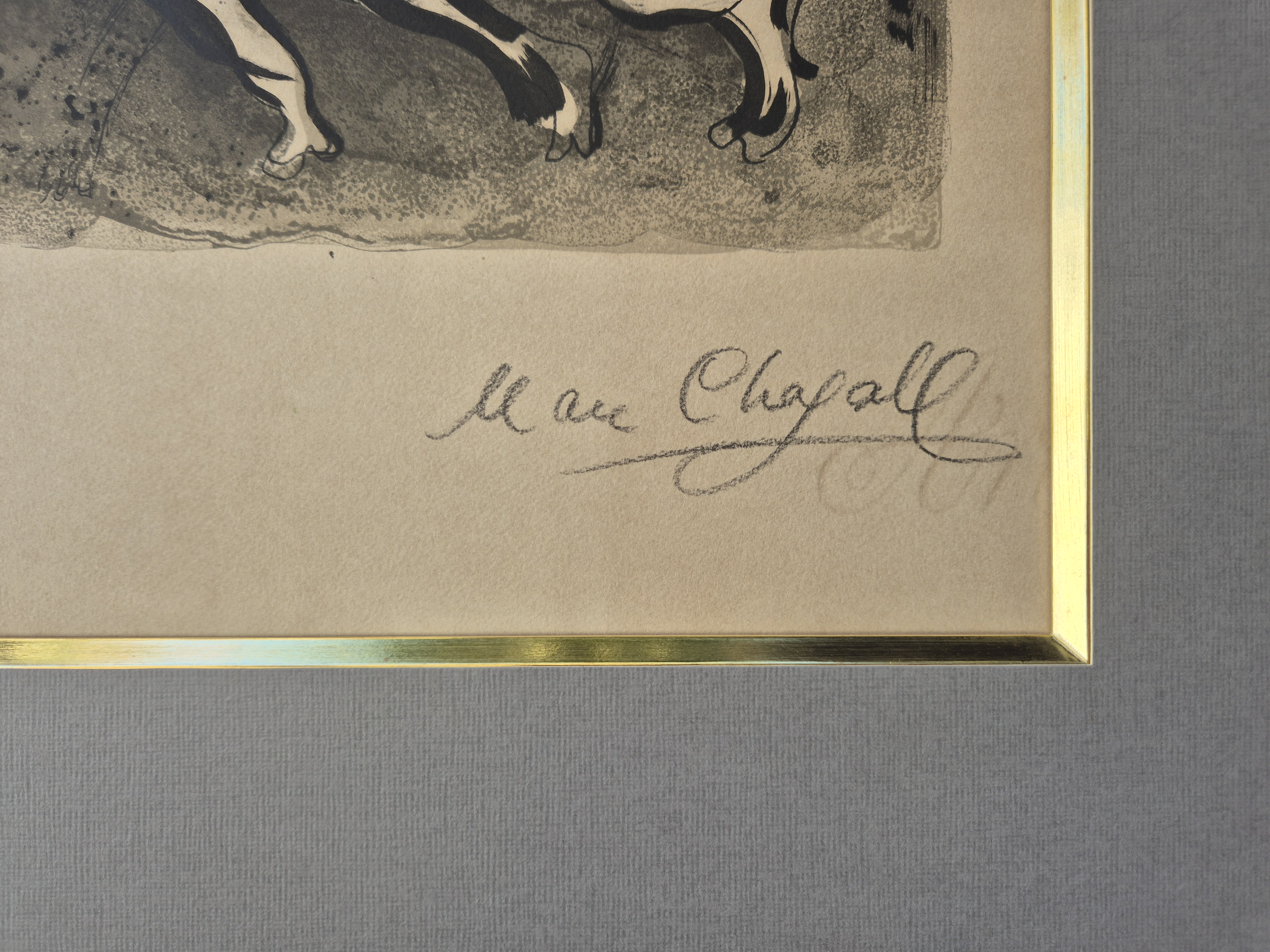 A framed print of a painting in a gold frame.