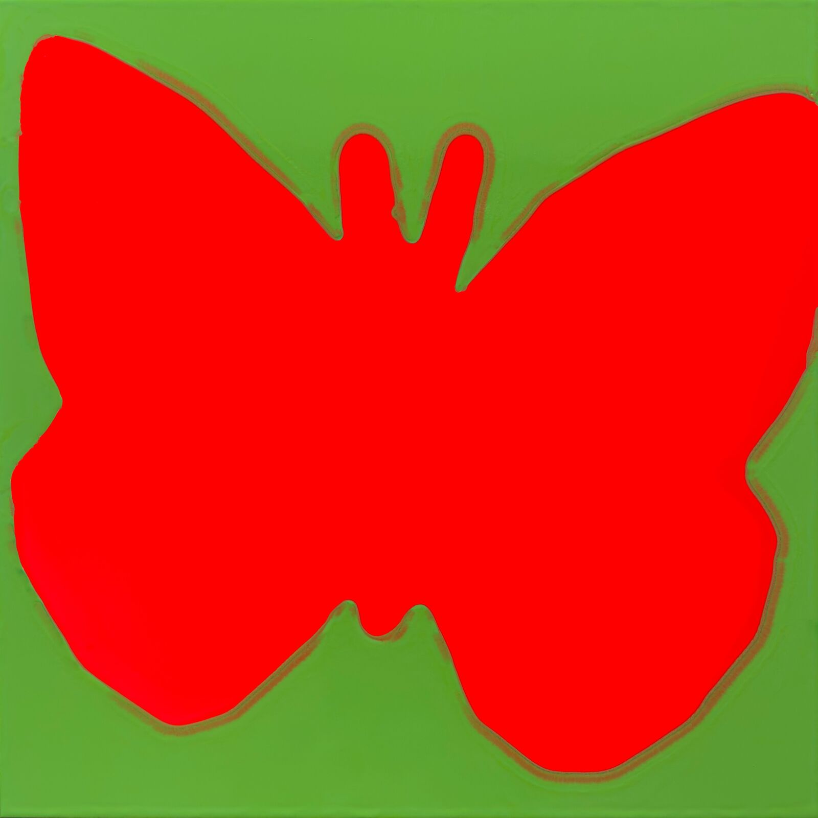 A red butterfly on a green background. 