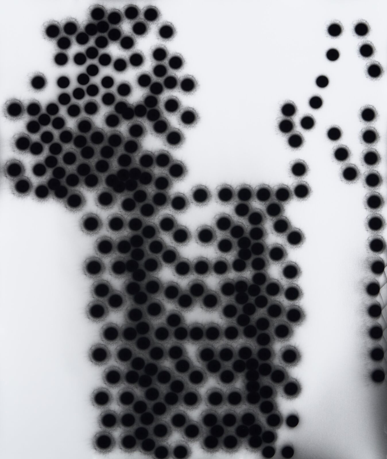 A black and white photo of a man made out of circles.