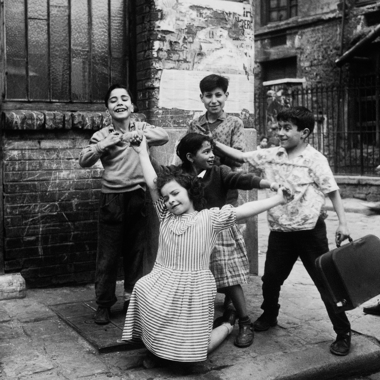 Children strike a pose, Cité Lesage-Bullourde, Paris by Marilyn Stafford, circa 1950
