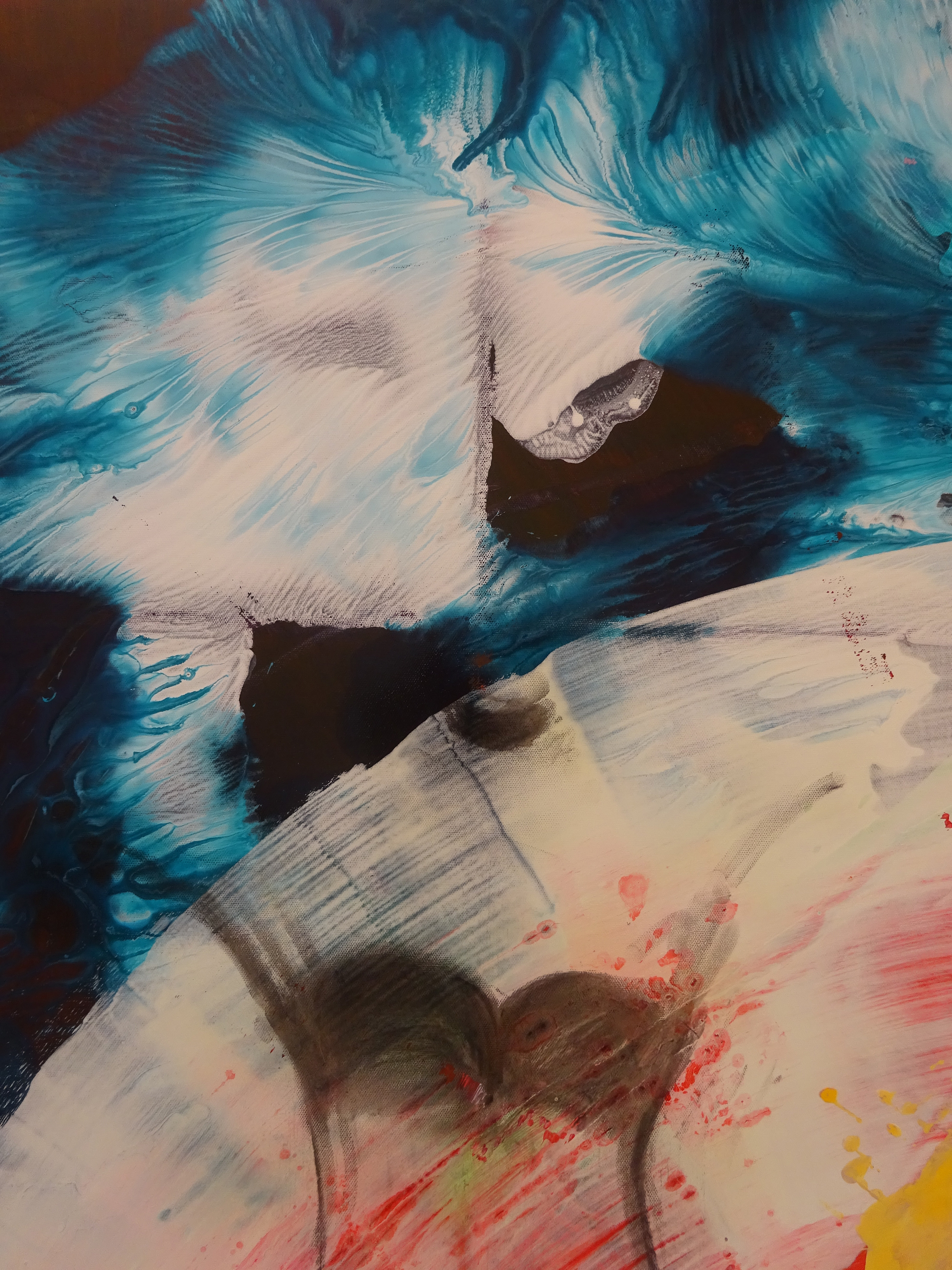 A painting of a colorful abstract painting on a wall.