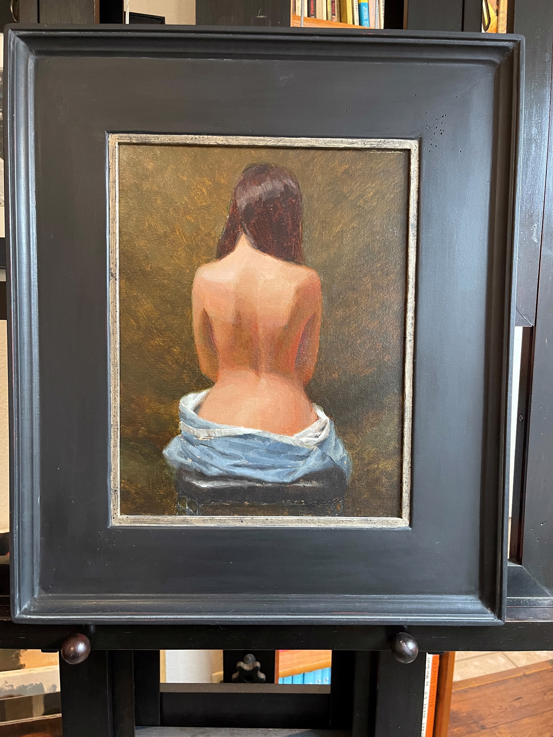 A painting of a woman wrapped in a blue towel.