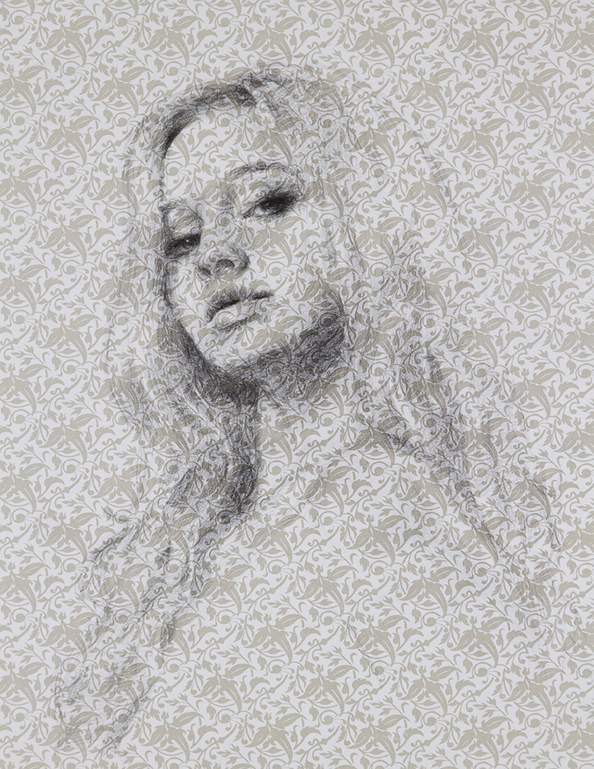 A drawing of a woman's face on a wall.